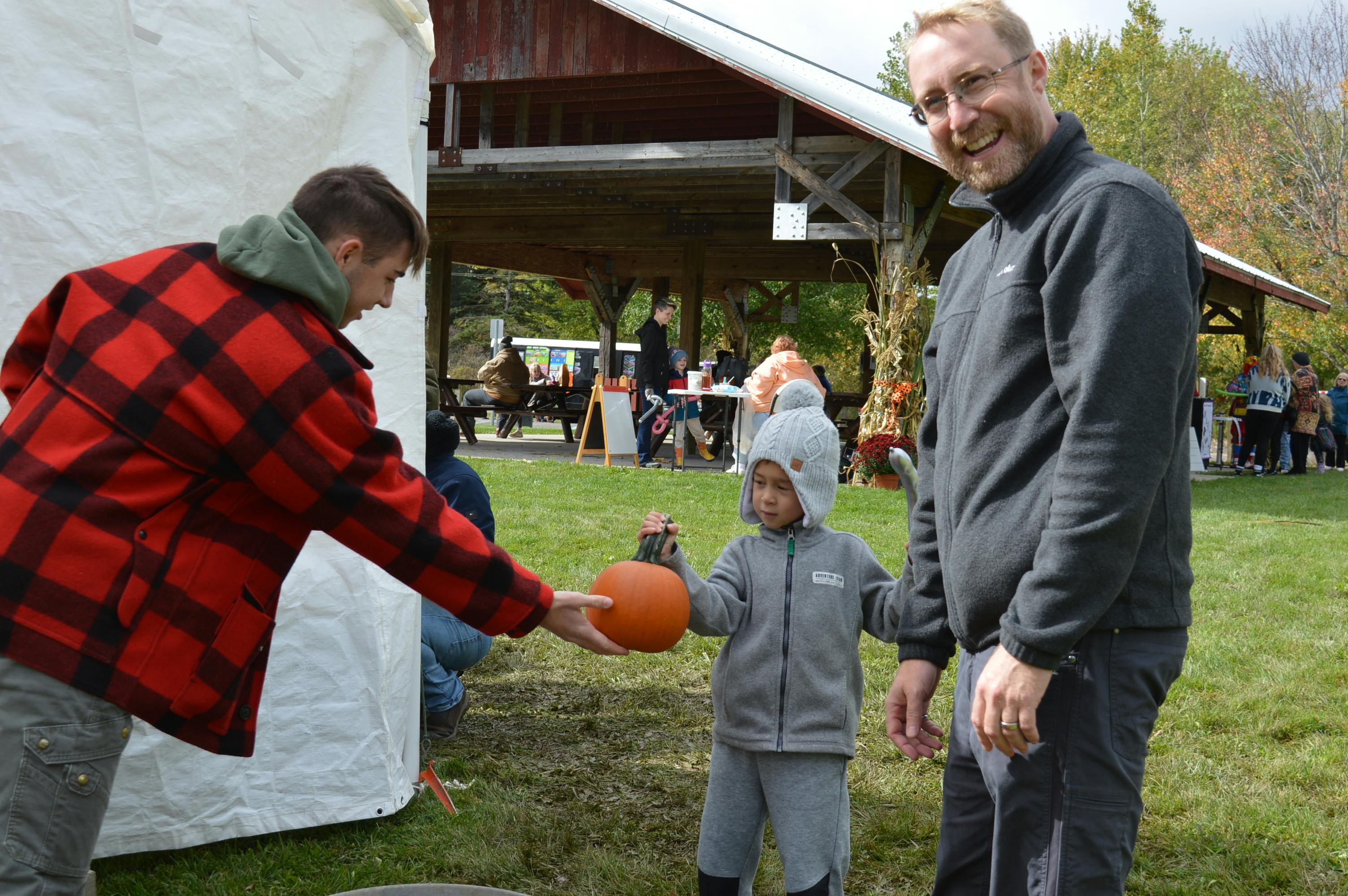 Dad approves of the free pumpkins to decorate at Harvest Fest!