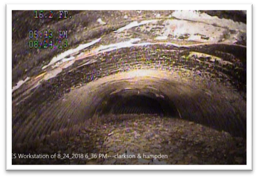 Image of CCTV footage of stormwater pipe full of debris.