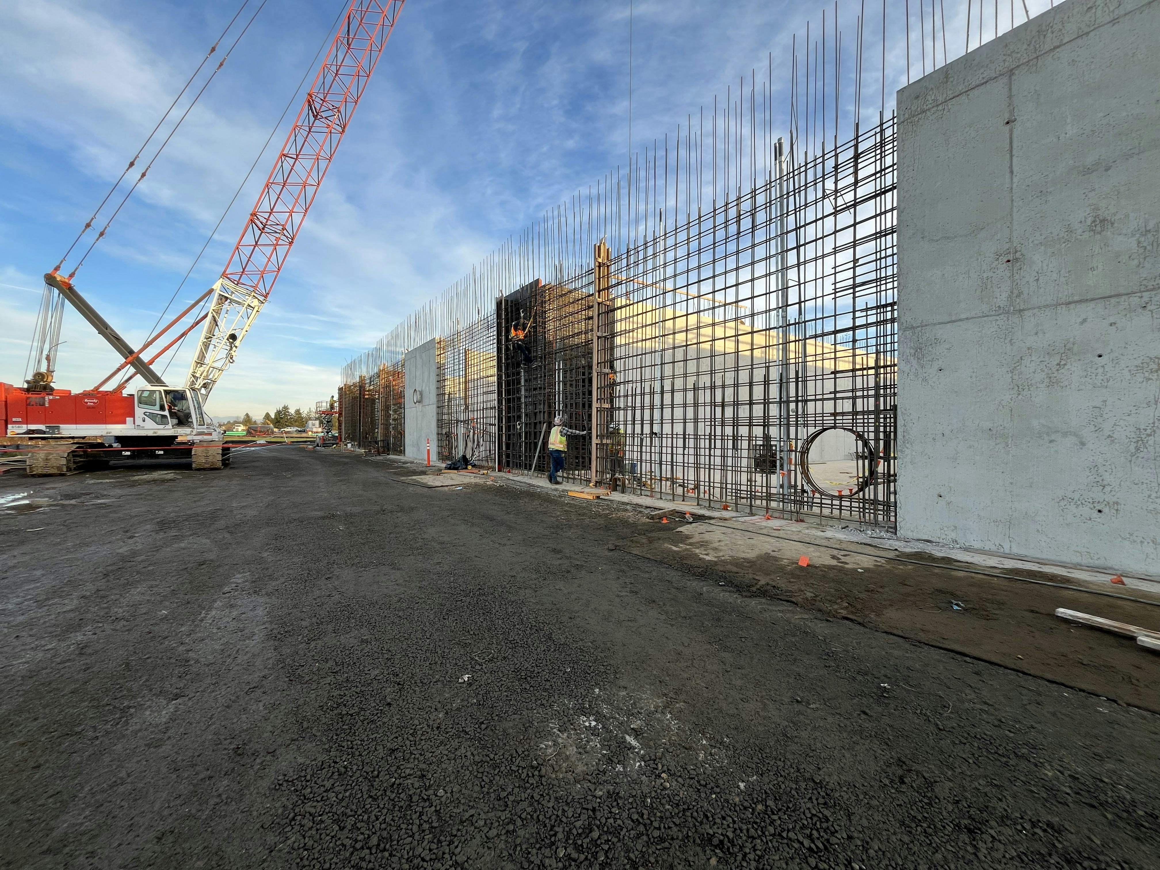 The last sections of the sequencing batch reactor walls to be pour are getting formed in. 