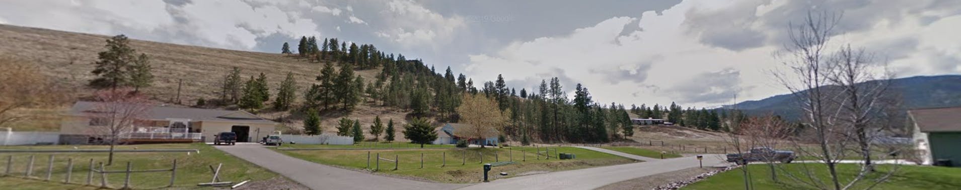 View of McCauley Meadows Subdivision proposed area. House in front of parcel.