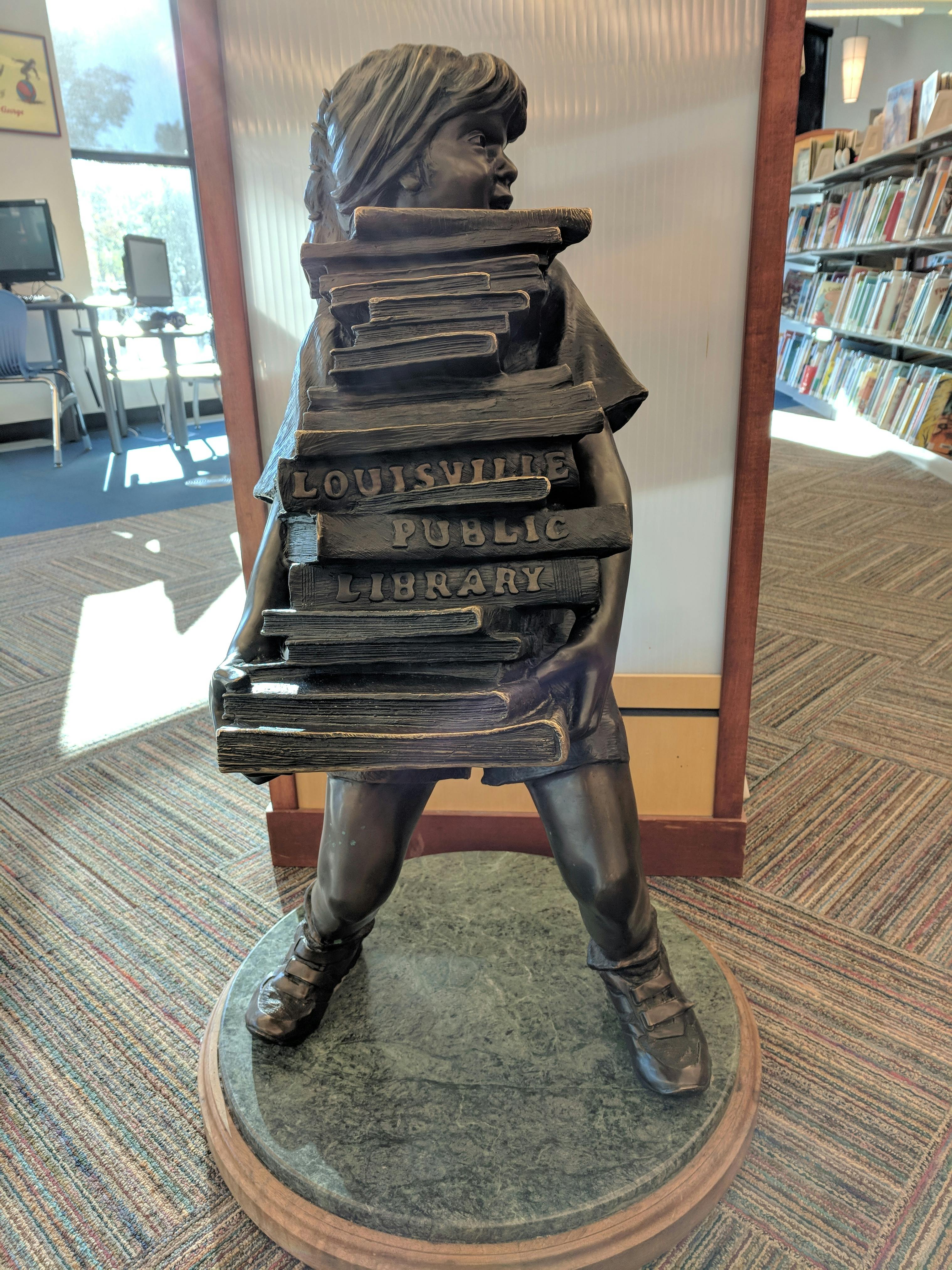 Bronze Child with Books - in Louisville library