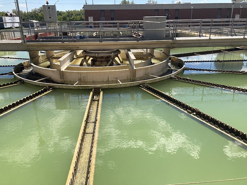 A crane lifts a piece of the clarifier out of Basin 3. The concrete will be repaired before new equipment is installed.