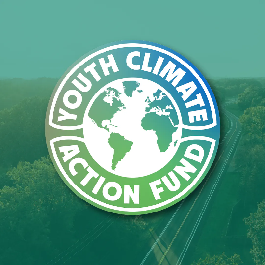 An image of the Youth Climate Action Logo overlayed on an aerial shot of Purgatory Park