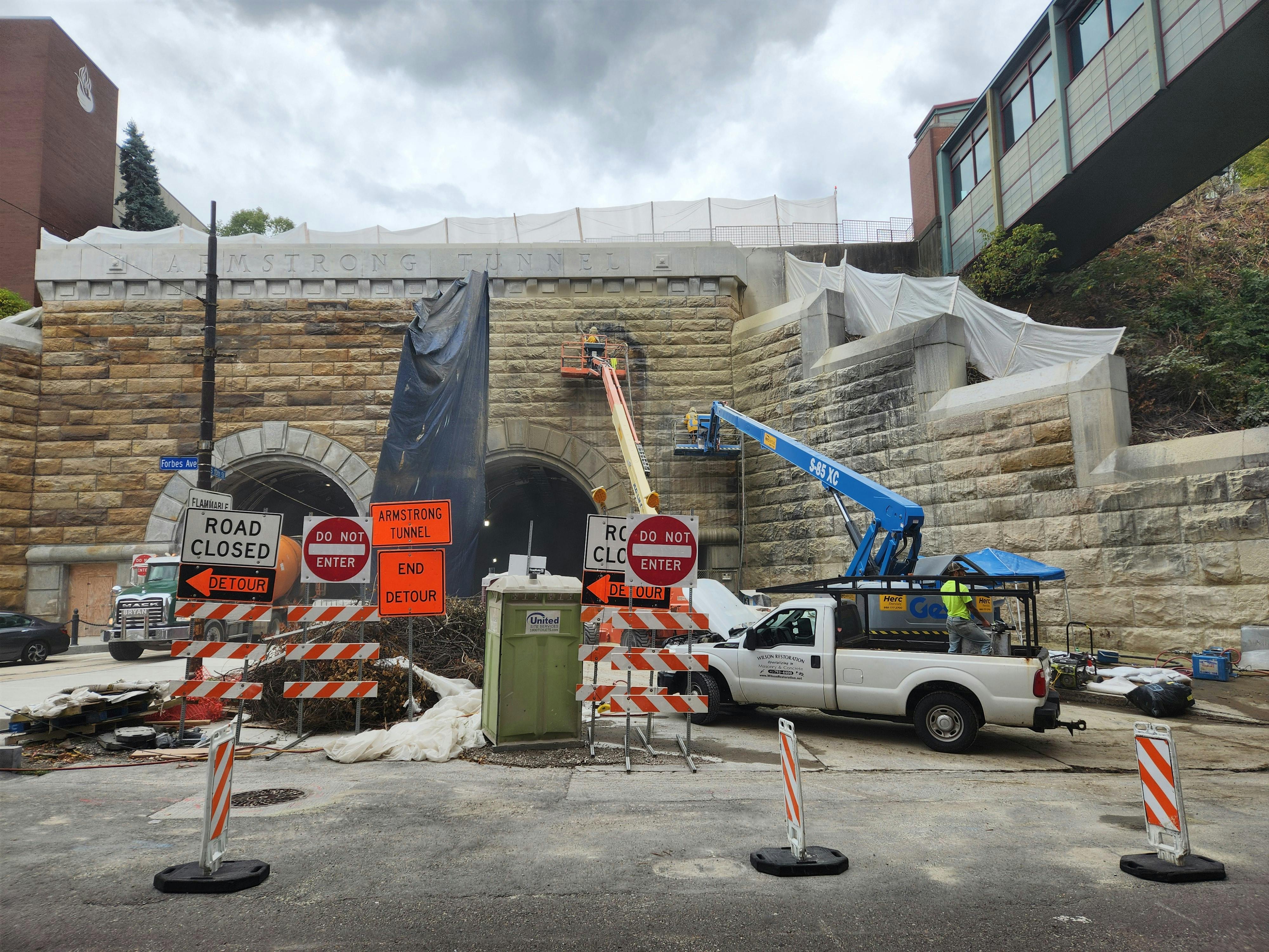 Crews clean the north portal of the Armstrong Tunnel