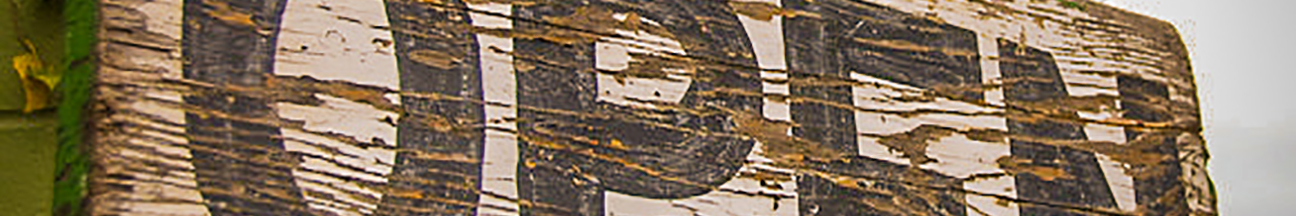 Weathered open sign