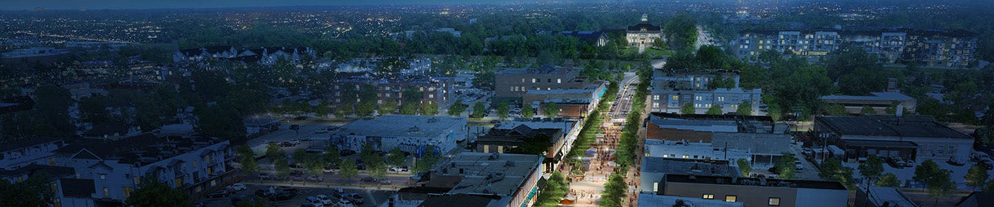 Wide street view on Littleton Boulevard, featuring cars, trees, and mid-century architecture.