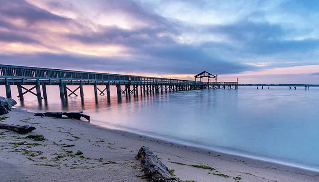 Pier at Leesylvania State park over water at sunrise