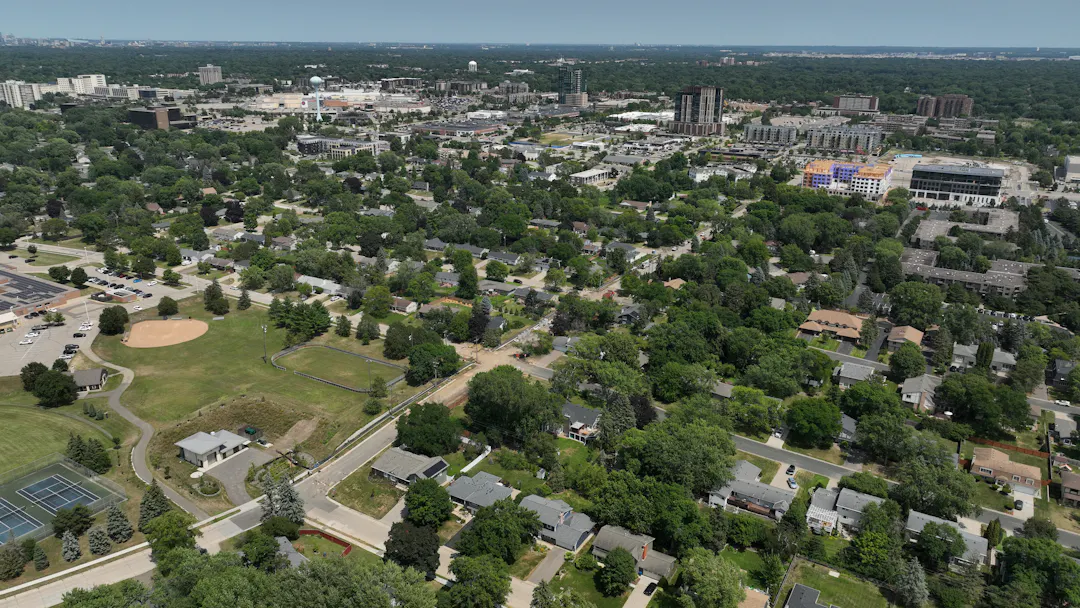 Aerial view of West 72nd Street under construction. Lift Station 6, Cornelia School Park & Southdale Water Tower are visible