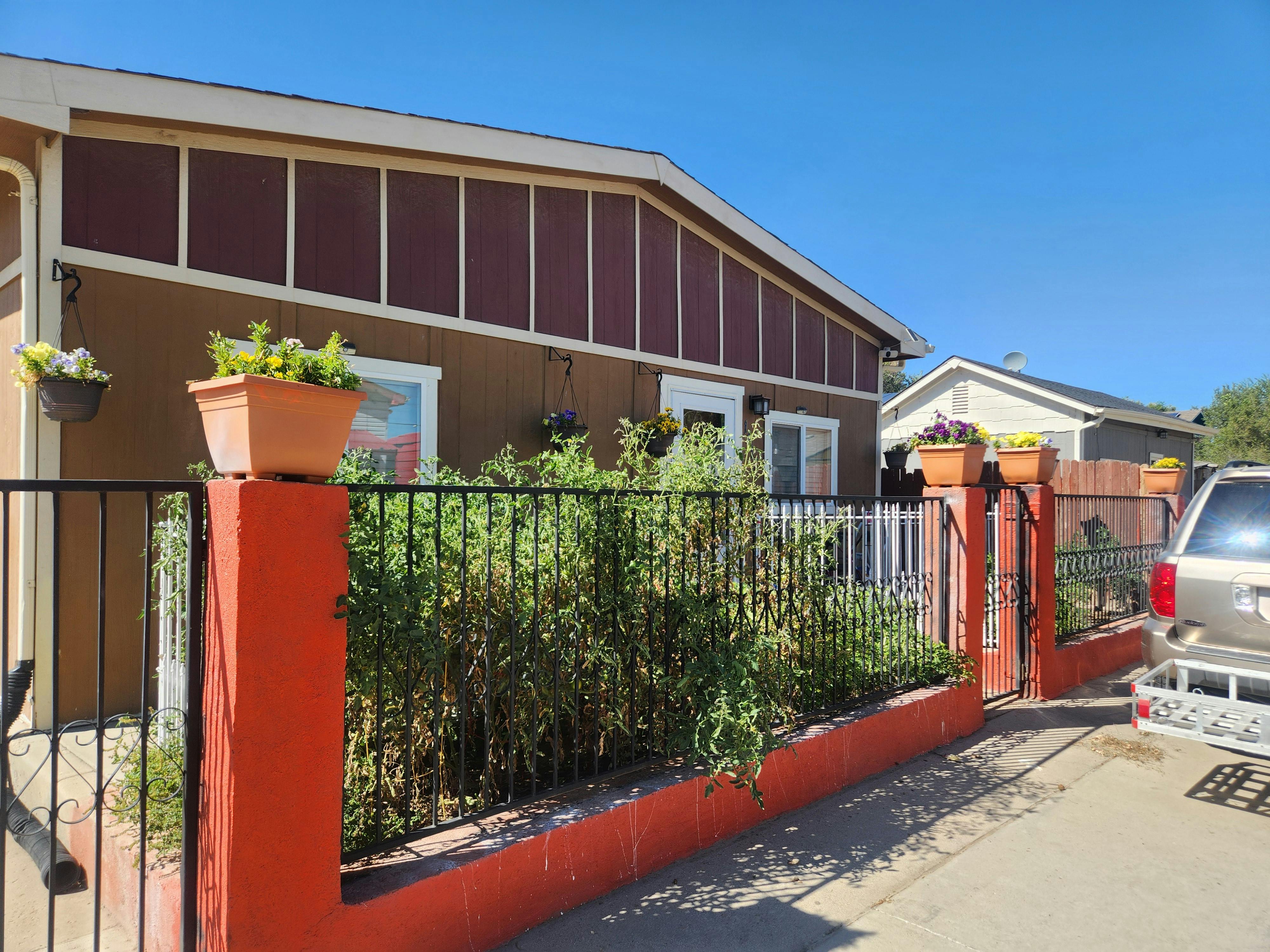 Home in Spanish Colony with fence and patio area.