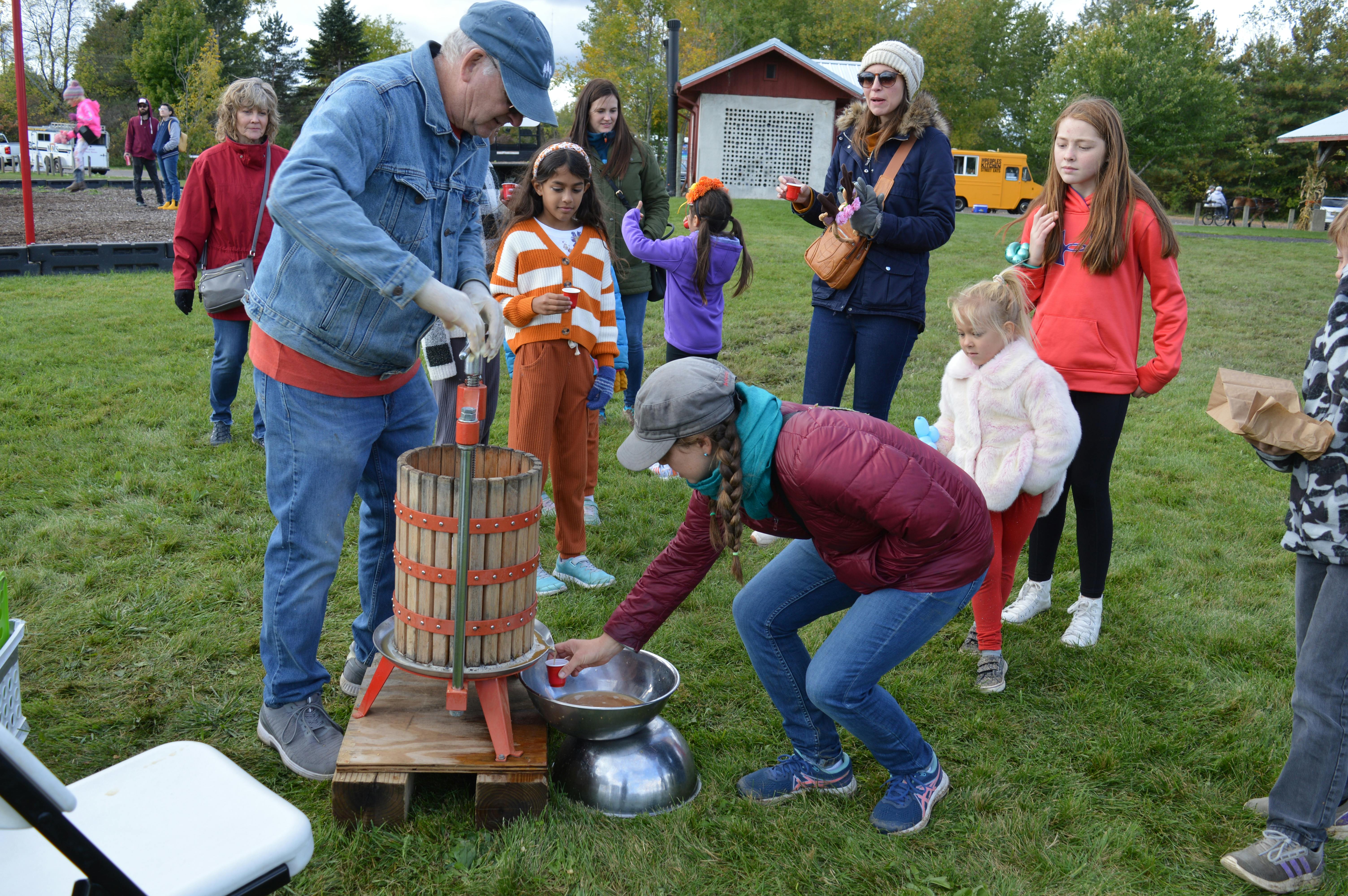 At last, fresh pressed apple cider. Cider press demonstrations presented by Flore Orchards.