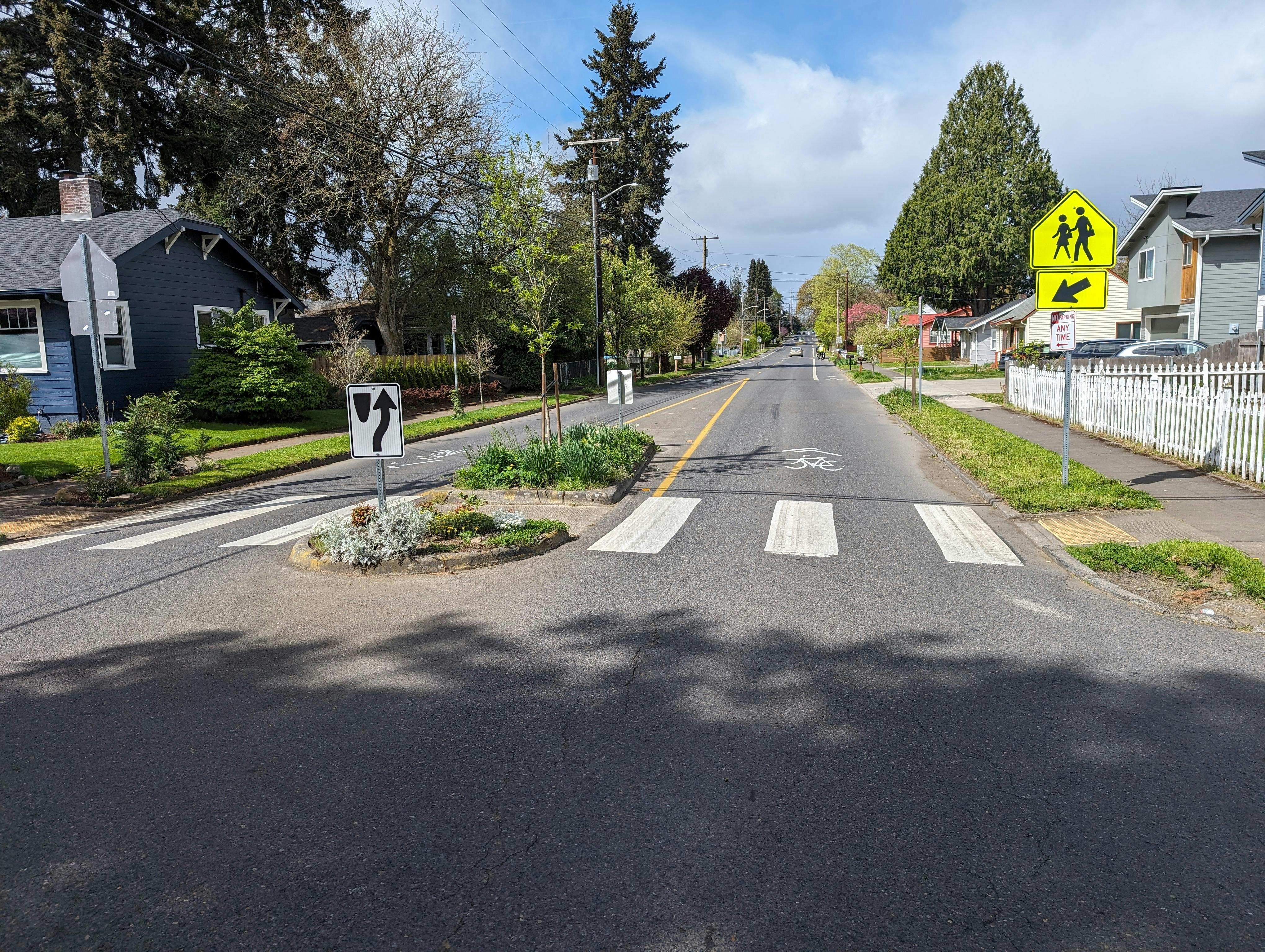 On 33rd Street, at midblock crossing locations east of N Street, the mobility lane changes to shared lane markings (sharrows), creating an inconsistent facility for bikes and small mobility.