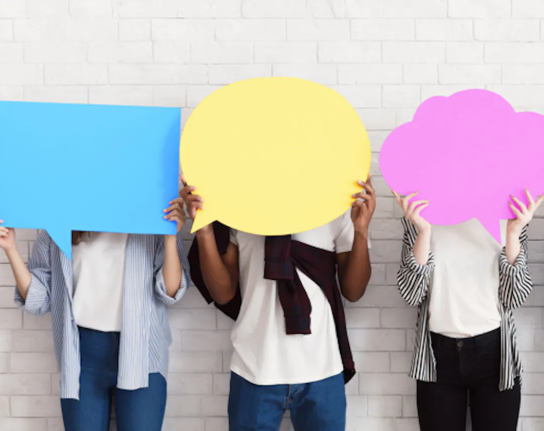 People holding up speech bubbles