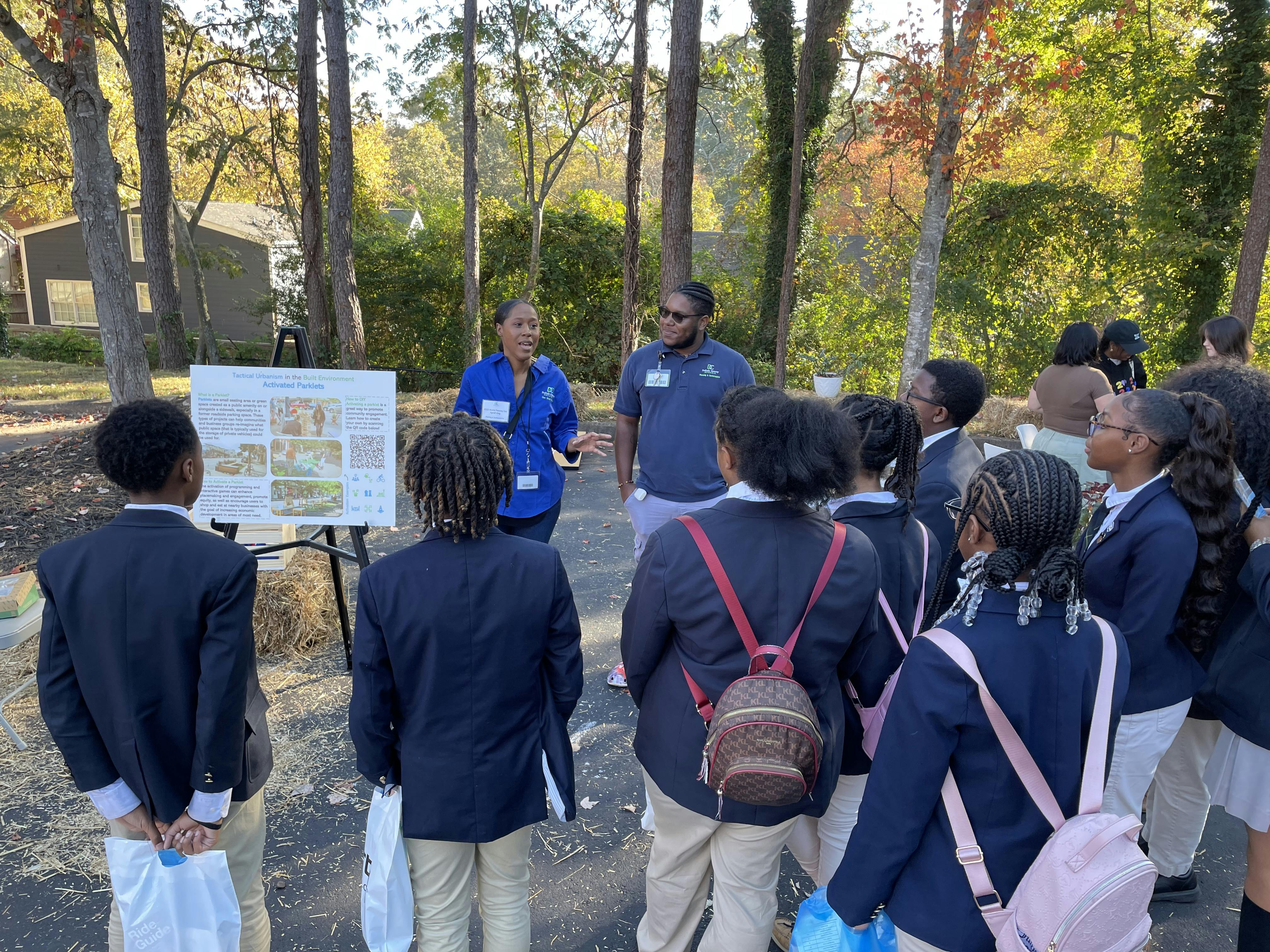 Students learning about activated parklet spaces