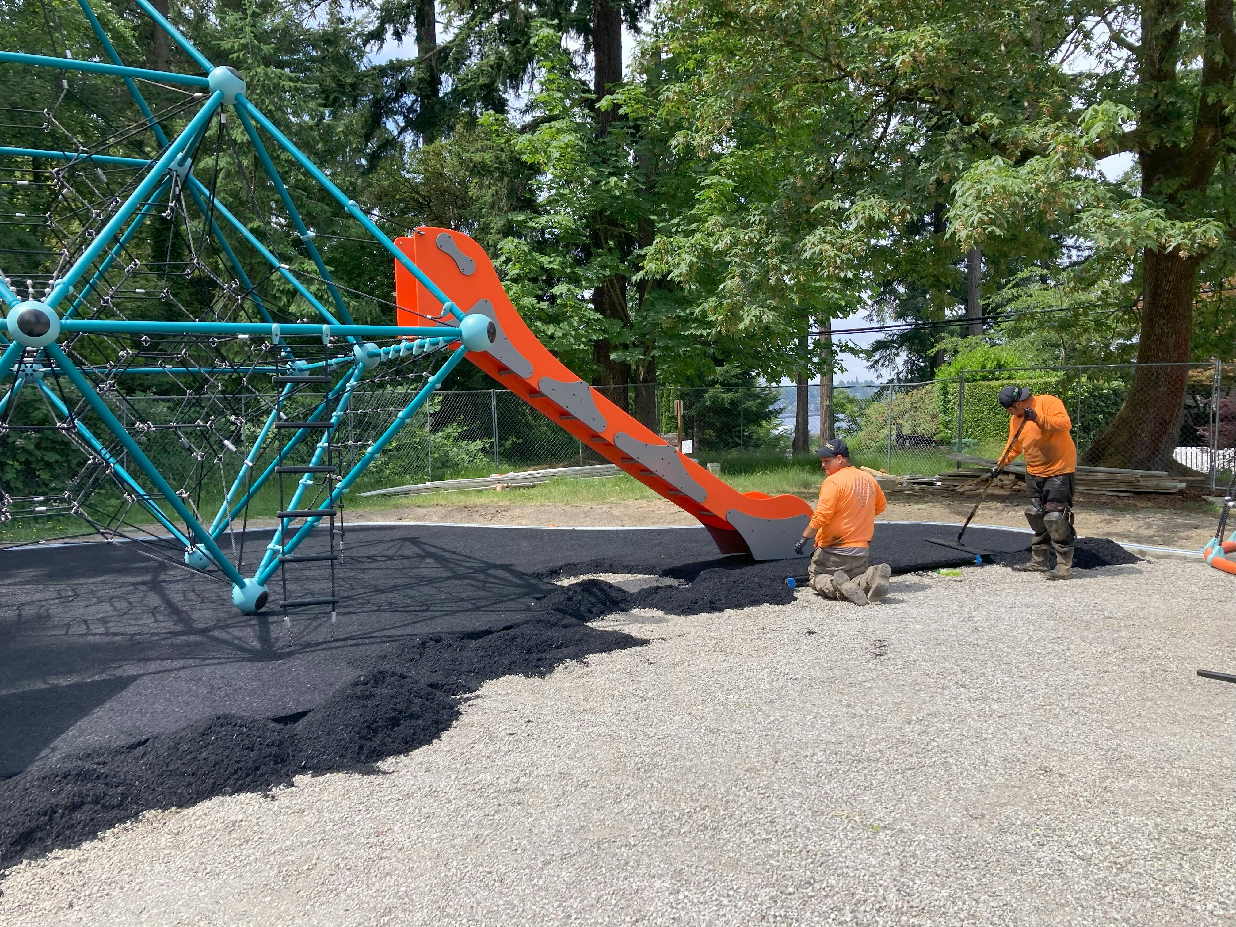 Installing the first layer of poured-in-place surfacing