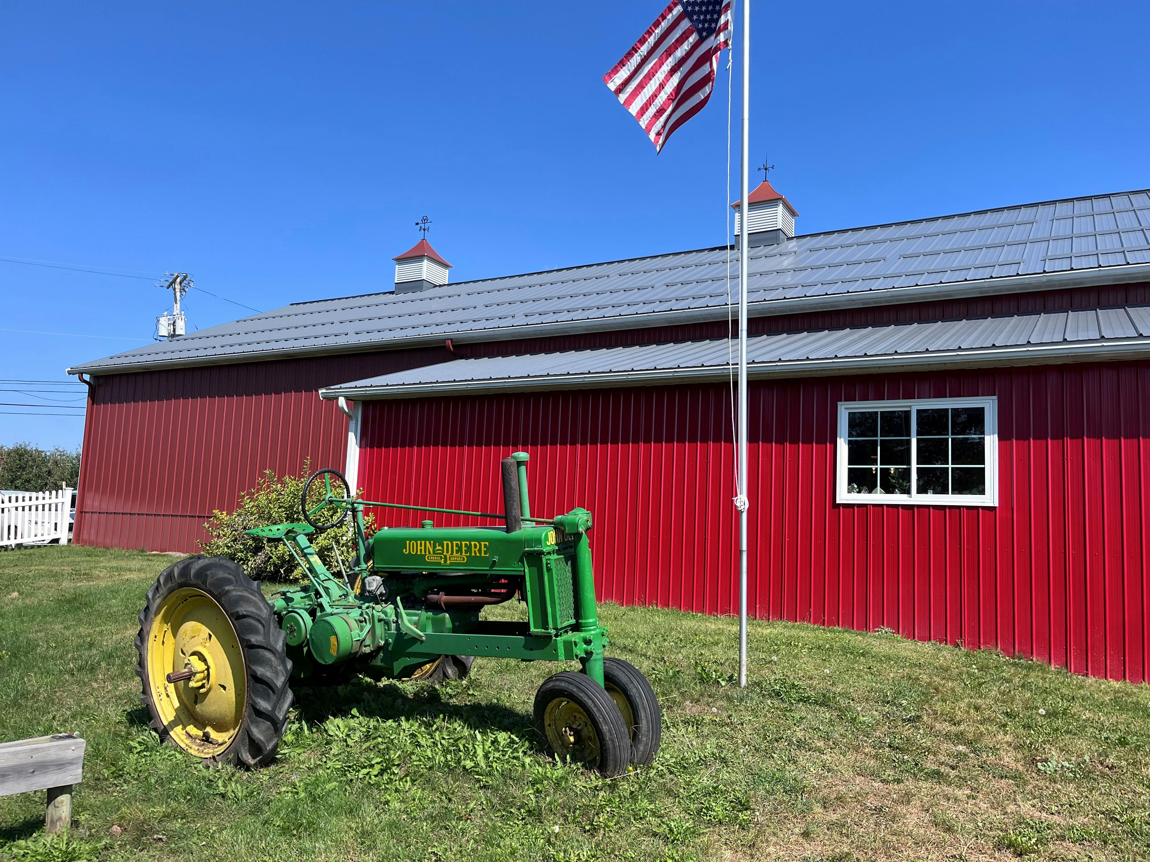 wide shot-green tractor and red barn - Bowman.jpg