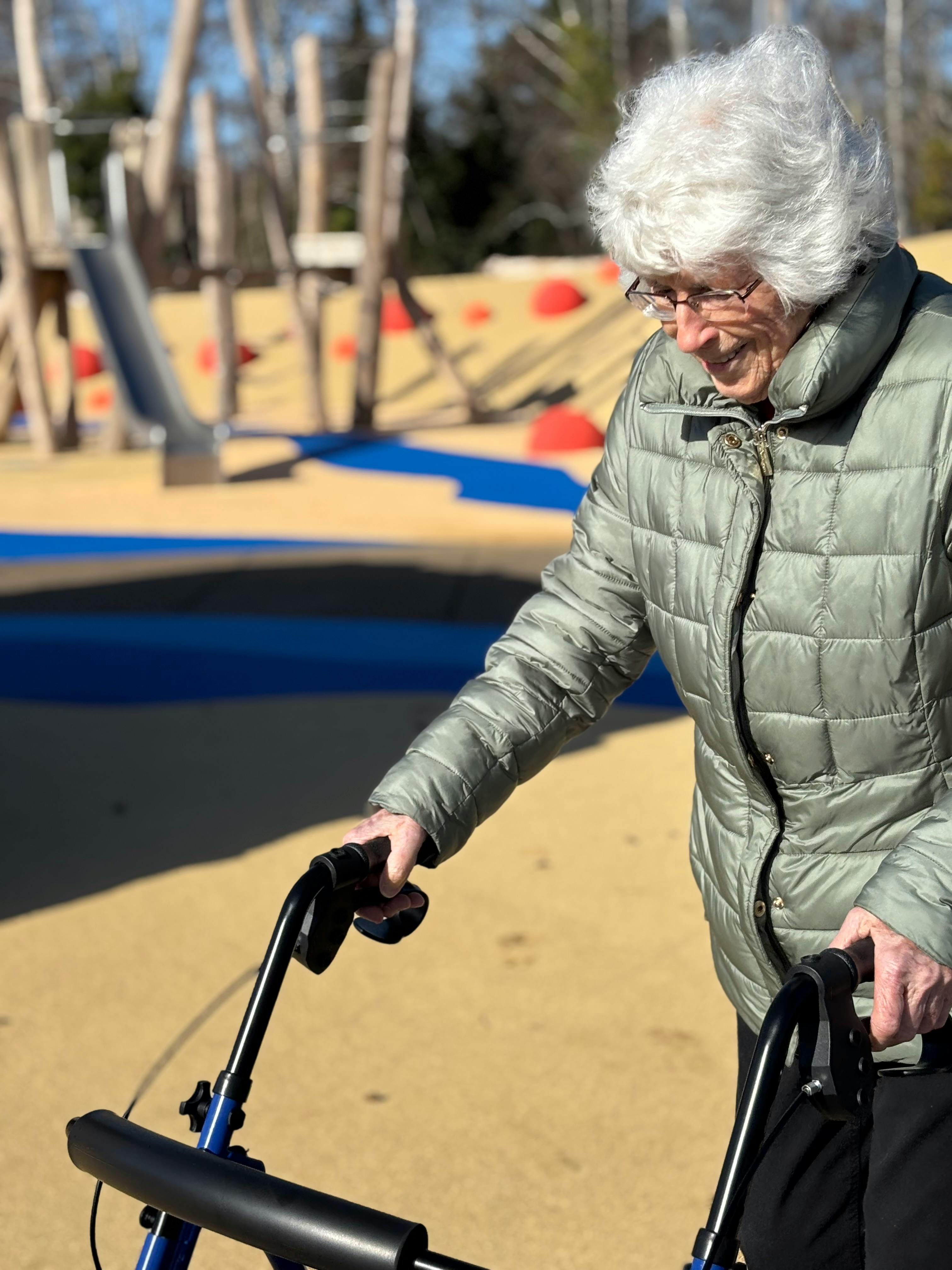 Visitor at SCDP enjoying the accessible playground surface