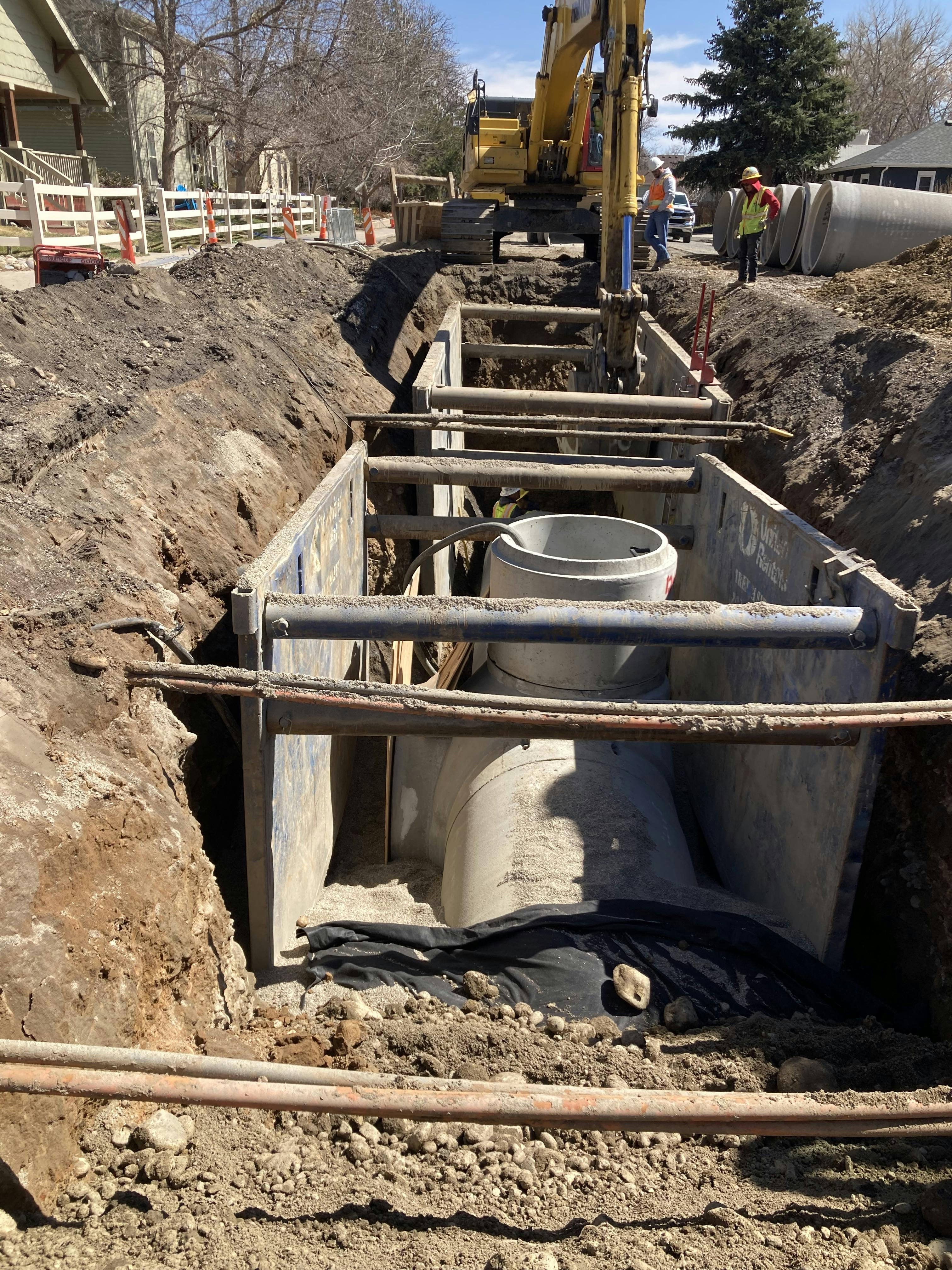 April 25, 2022 - Construction crews installing 60-in concrete storm sewer on W. 1st Street.