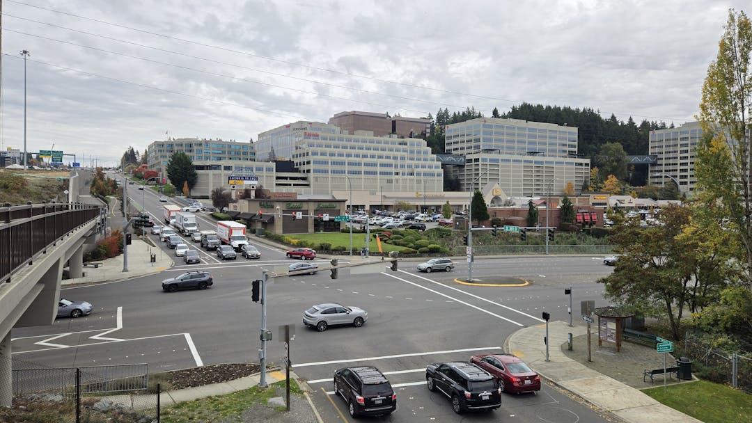 Photo of 4 women behind sign and balloons celebrating "shop factoria"