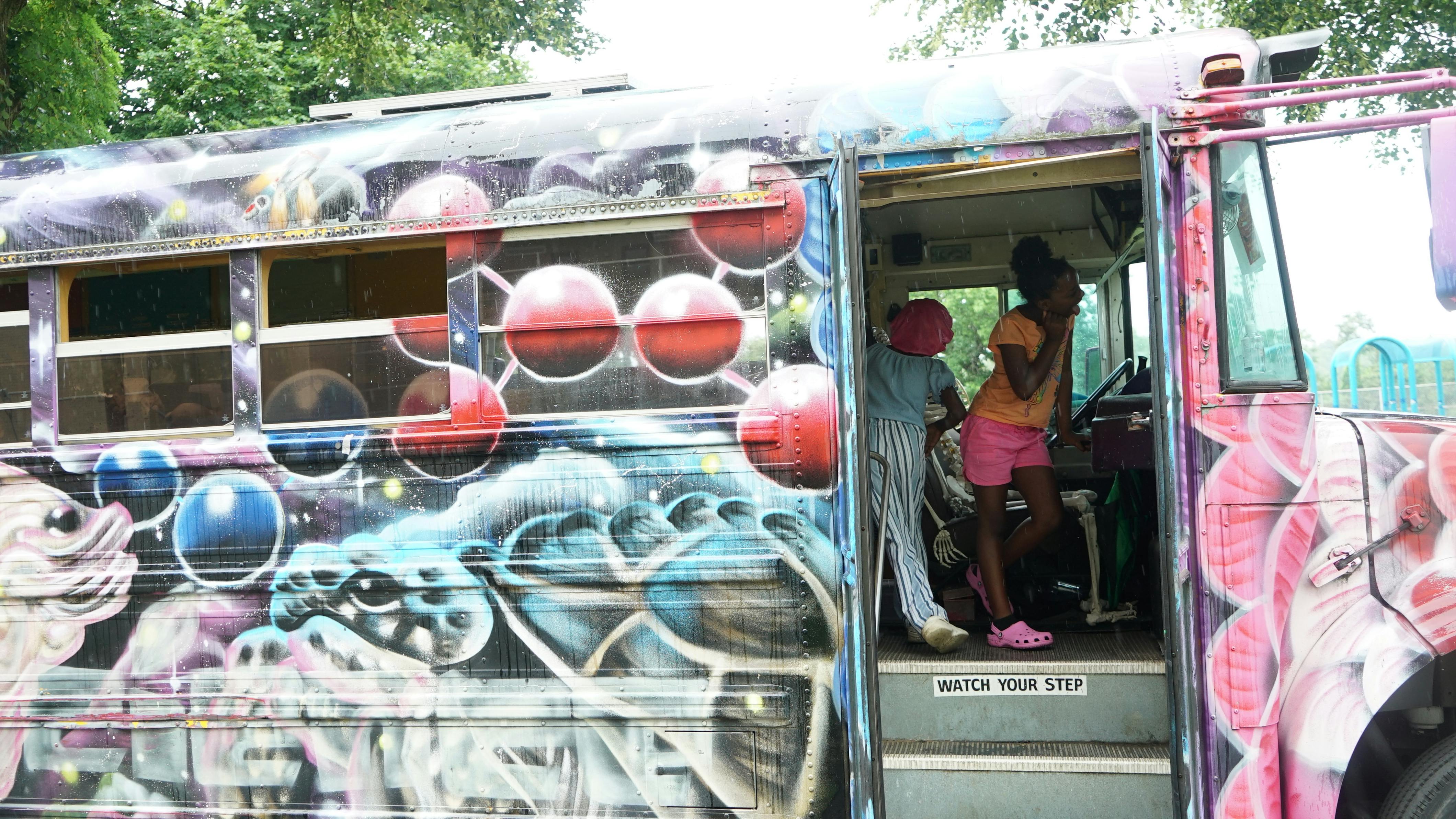 The Pittsburgh Community Science Workshop bus teaches children about physics and other cool science facts at a Community Day event.