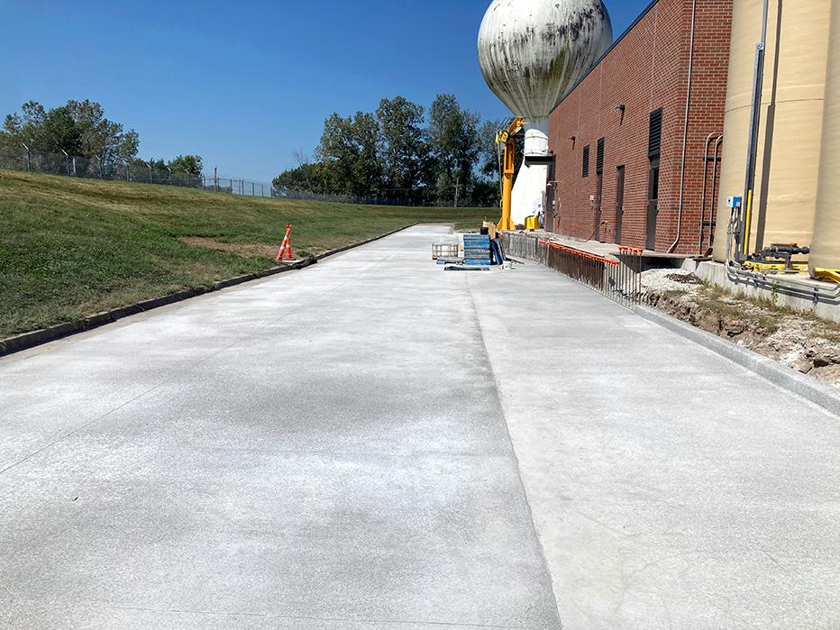 The road in front of the Chemical Building has been poured and is curing. The road was reconstructed to address stormwater issues.
