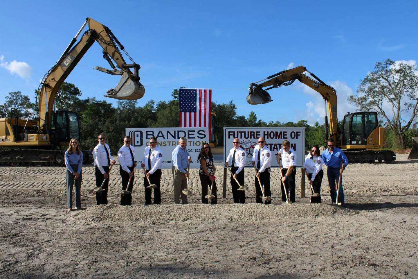 several people digging with shovels for groundbreaking event