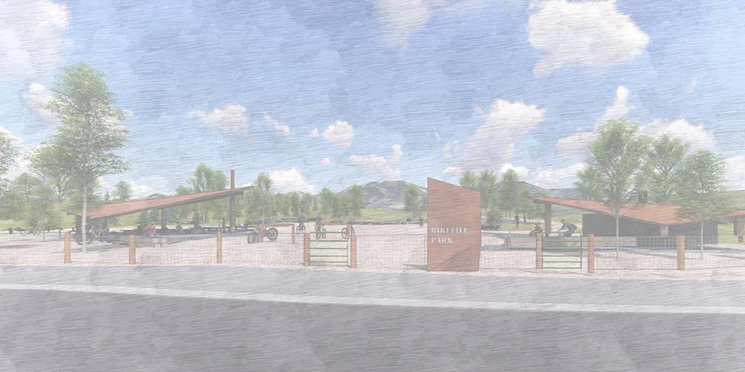 A trail through forest and hills with terrain marked by arrows signaling different skill levels. Image by Richard Hayes.