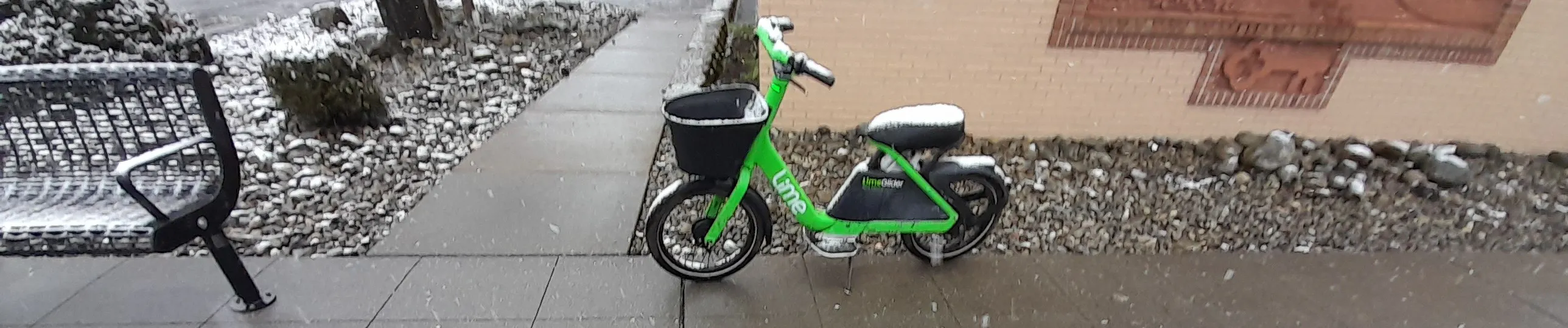 Lime vehicle parked with snow