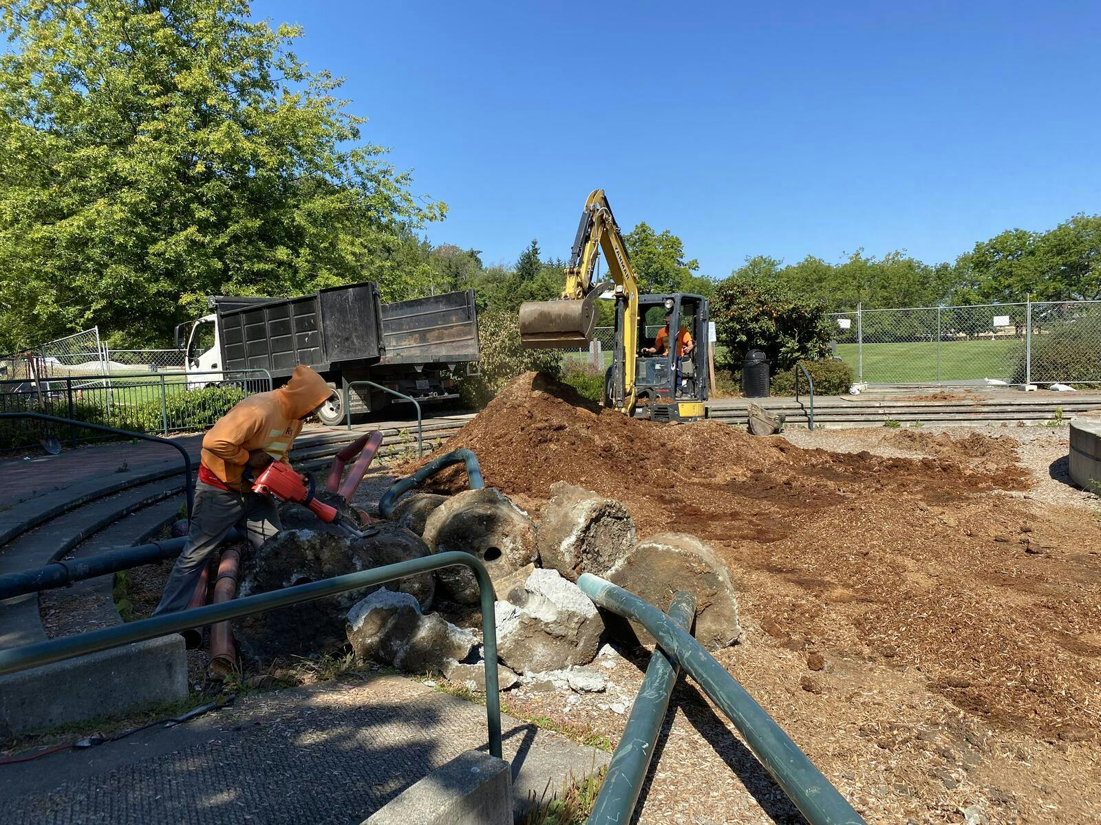 Crews pave way for new playground equipment