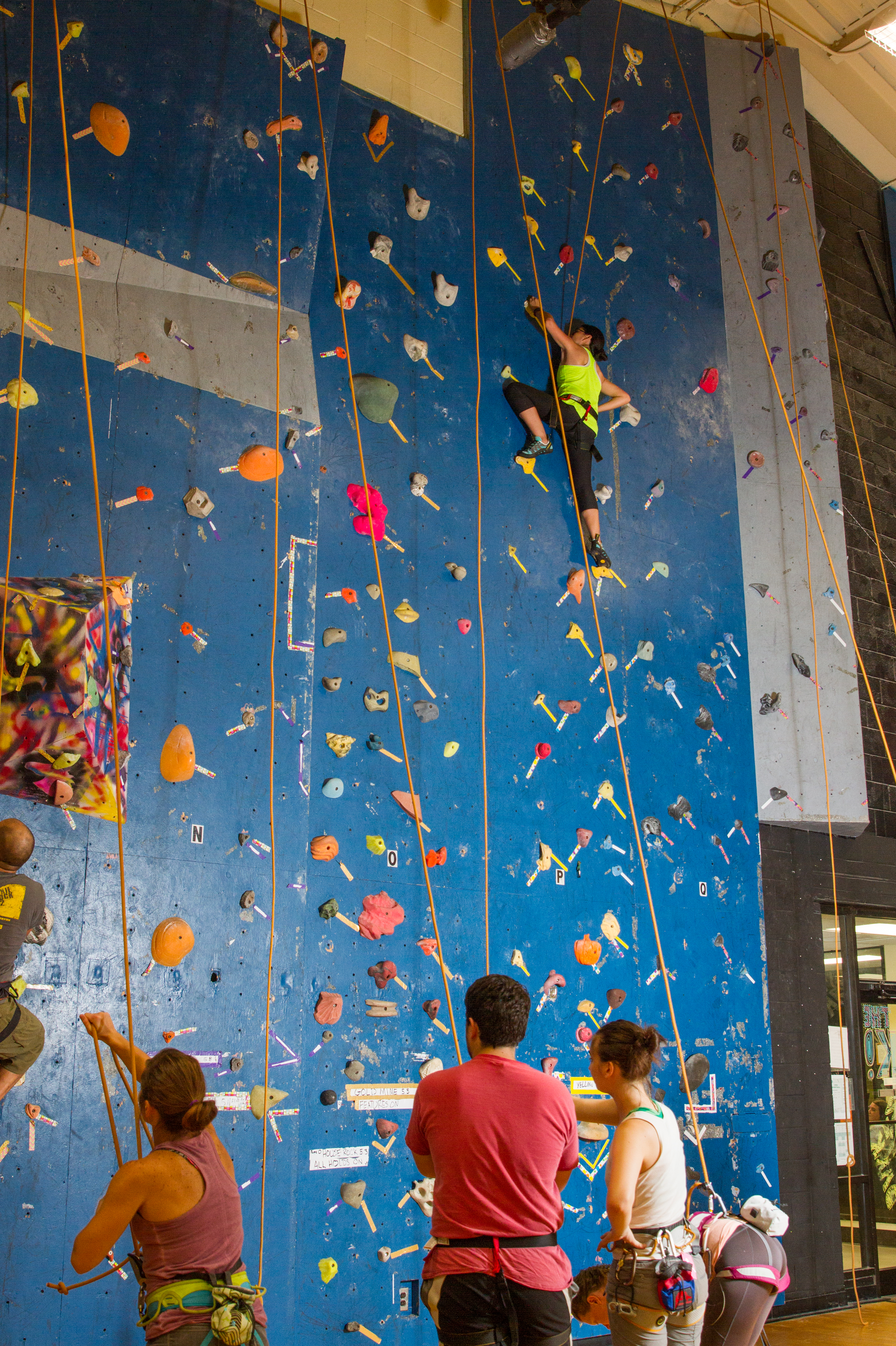 Photo of climbing wall with climbers at the Community Center