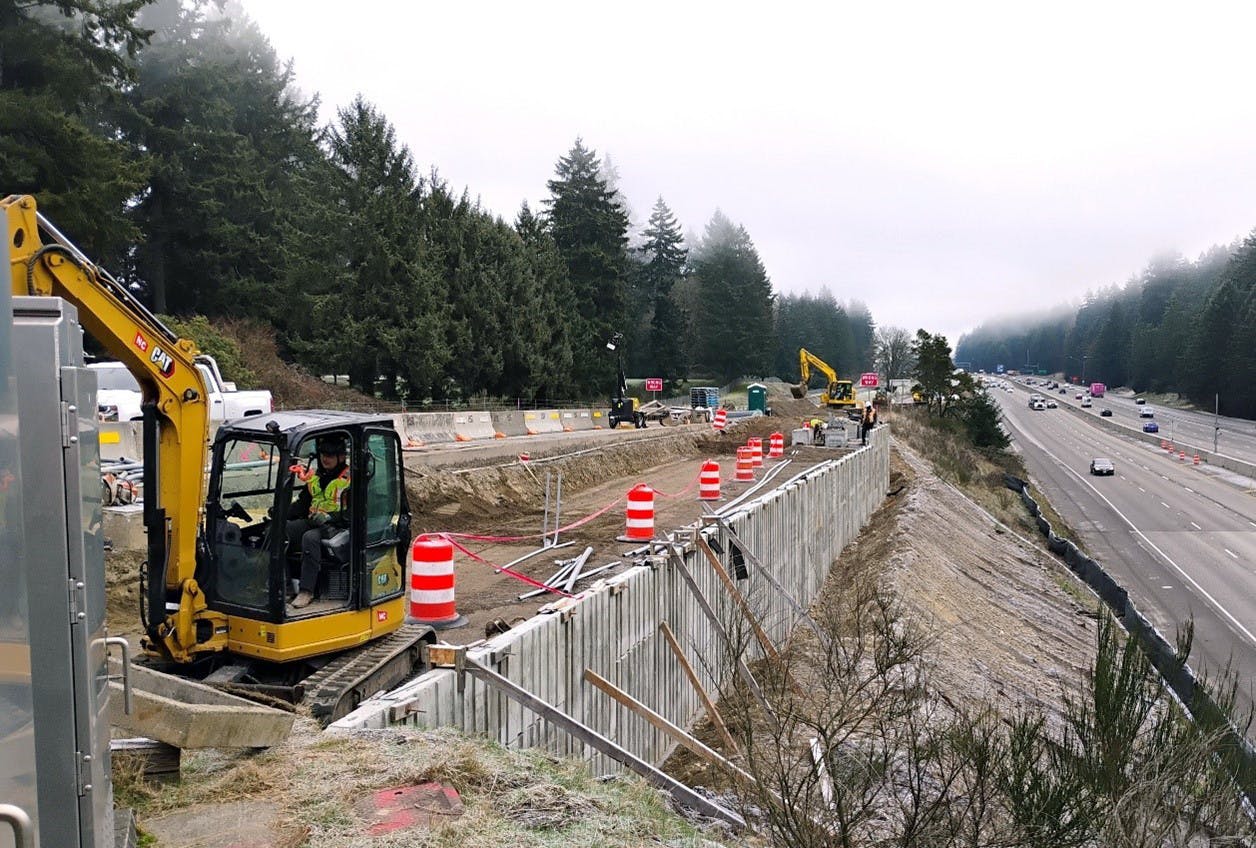 Photo showing construction of the new wall between the Mounts Road exit and southbound I-5.