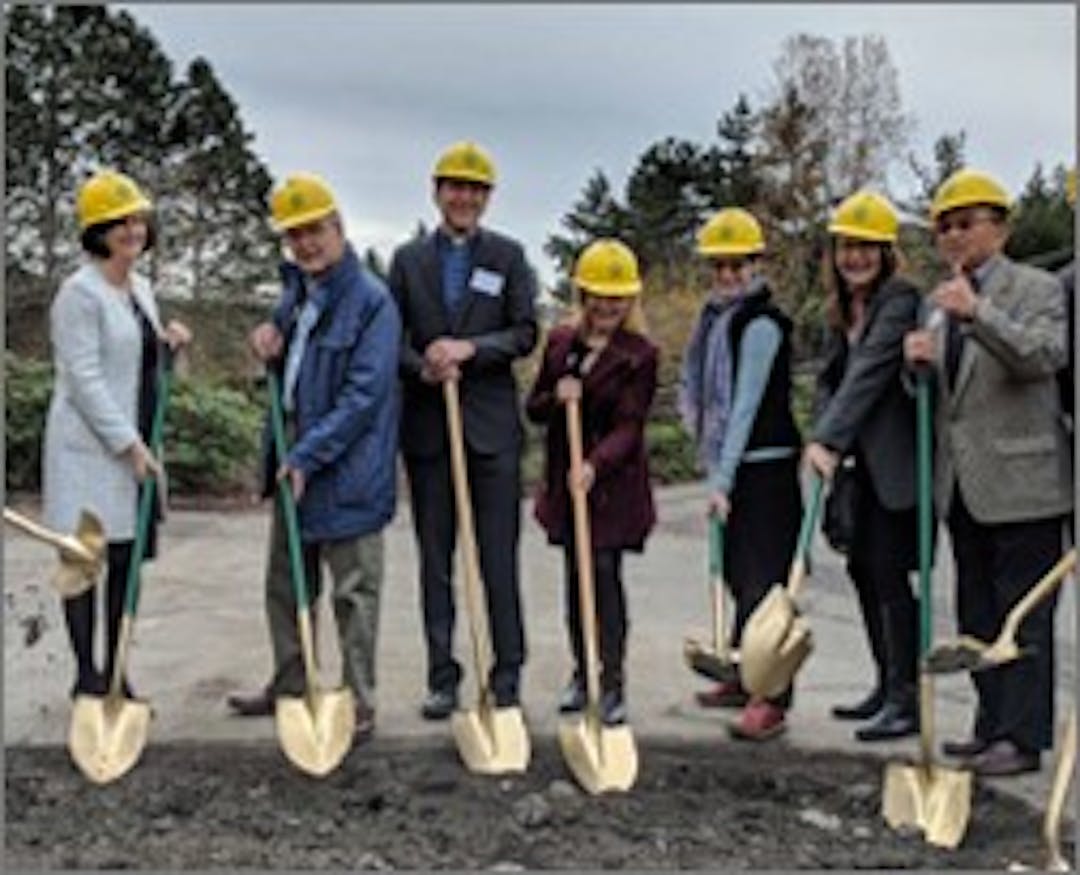 City council members with golden shovels, breaking ground for new housing.