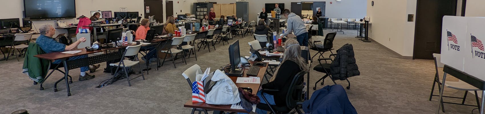 View of Missoula County Elections Center before an election, with staff sitting at tables
