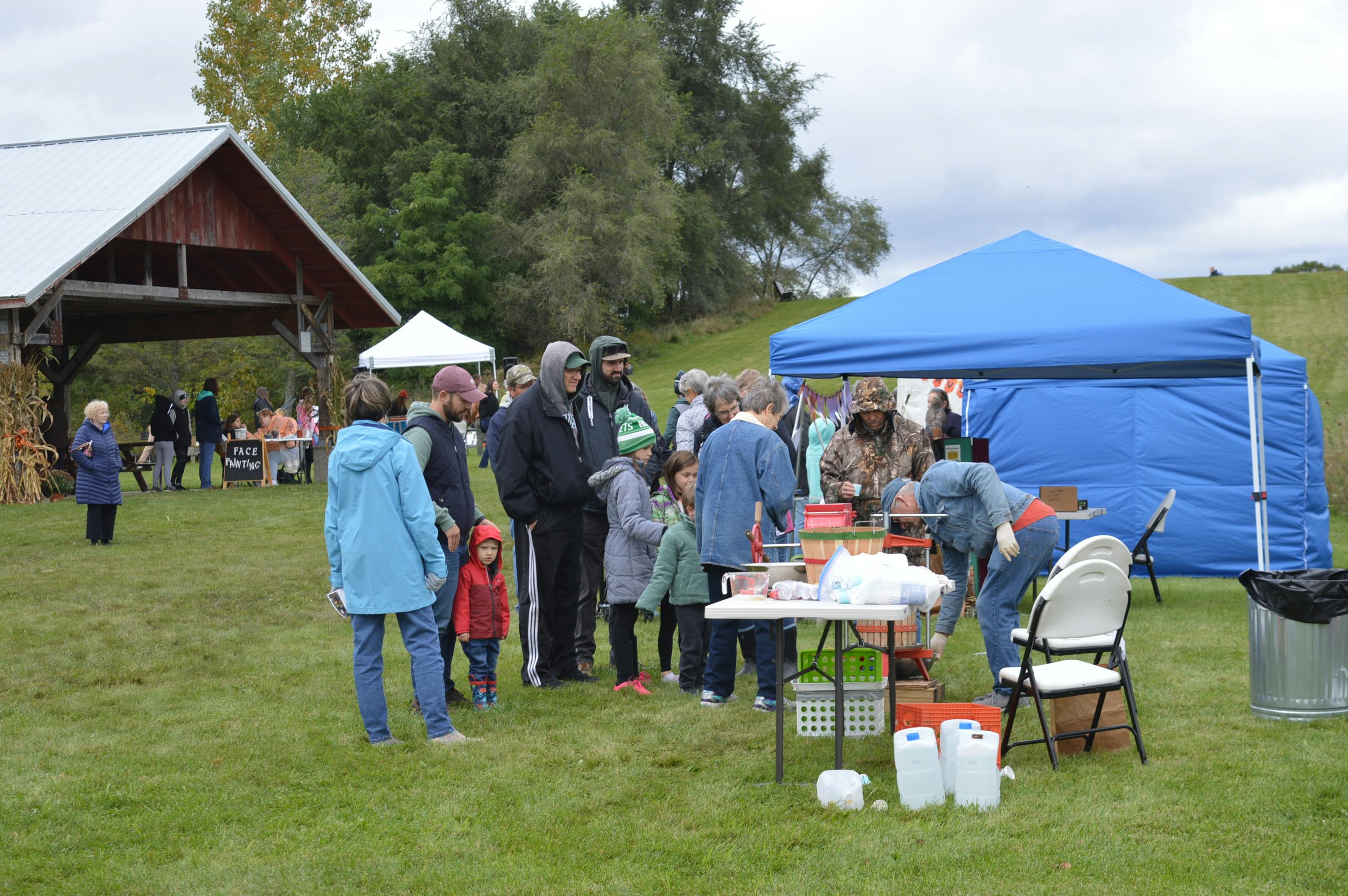 Guests eagerly wait for the fresh cider samples straight from the cider press.