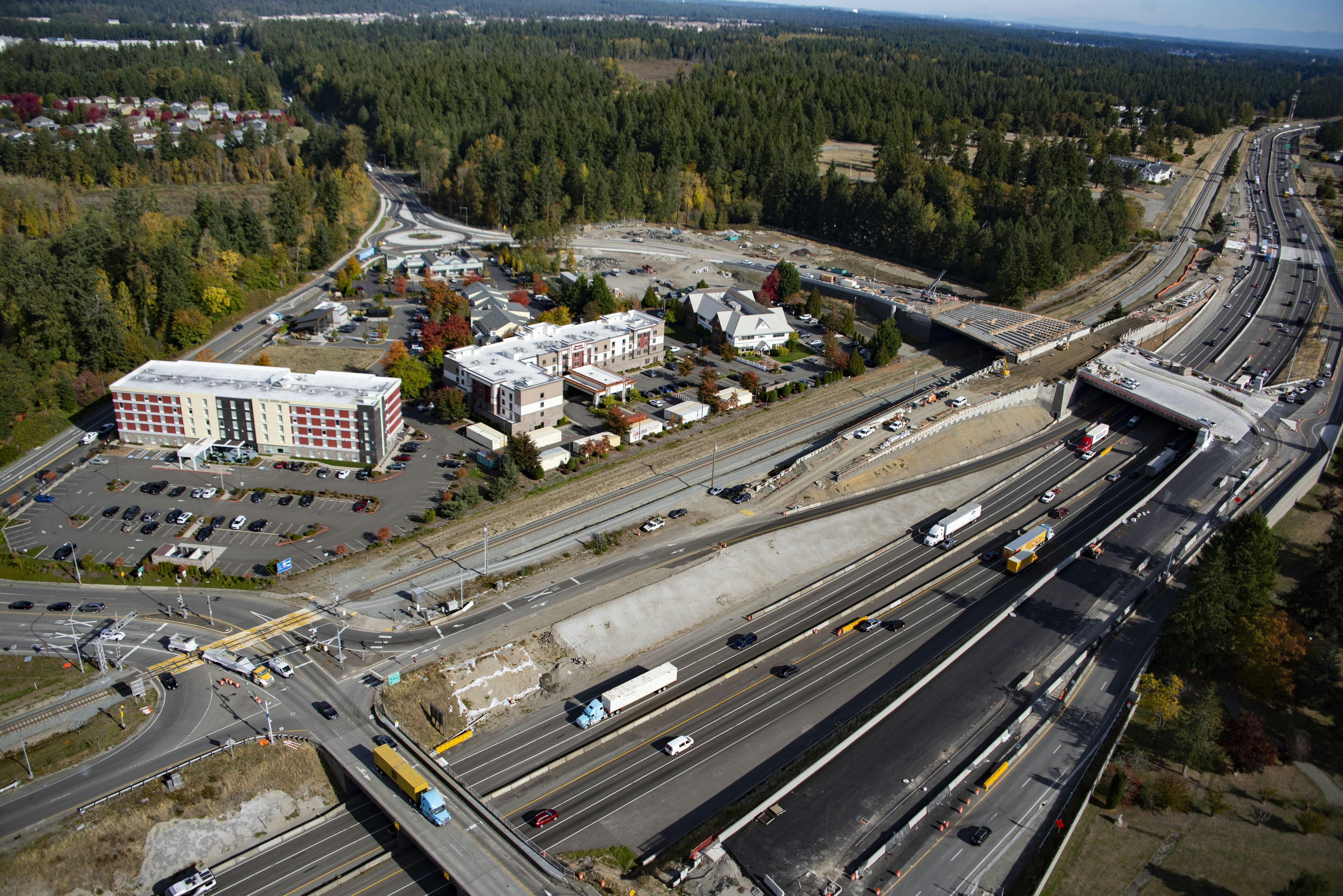 Aerial view of the new pavement between two I-5 overpasses.