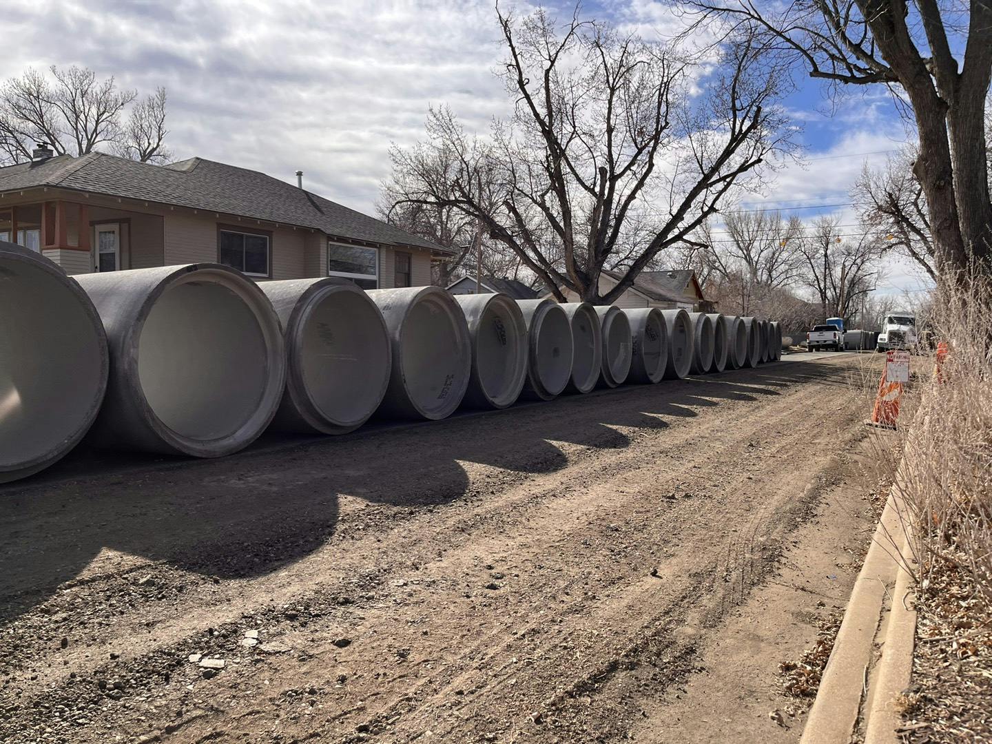 Large sections of stormwater pipe staged near 3rd Street.