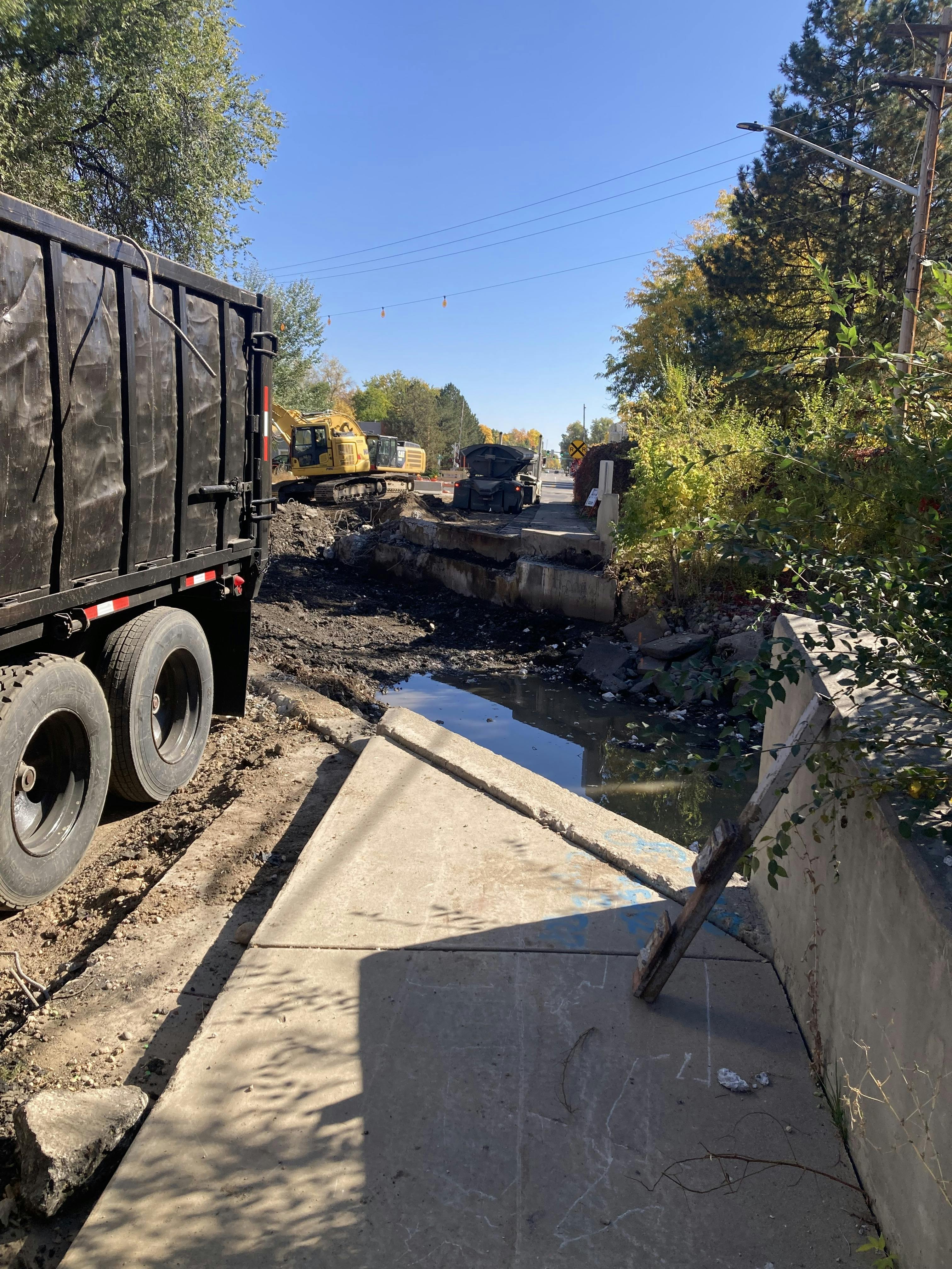 October 2022 - Crews work to remove the bridge demolition debris.