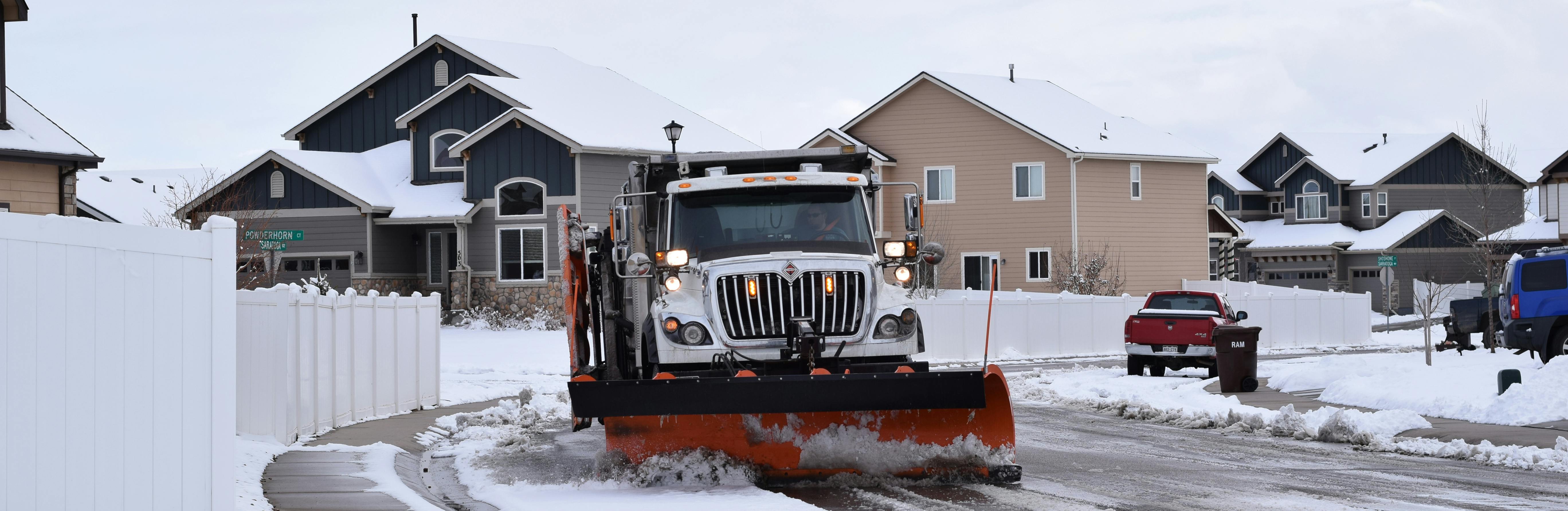Windsor snow plow in a residential neighborhood