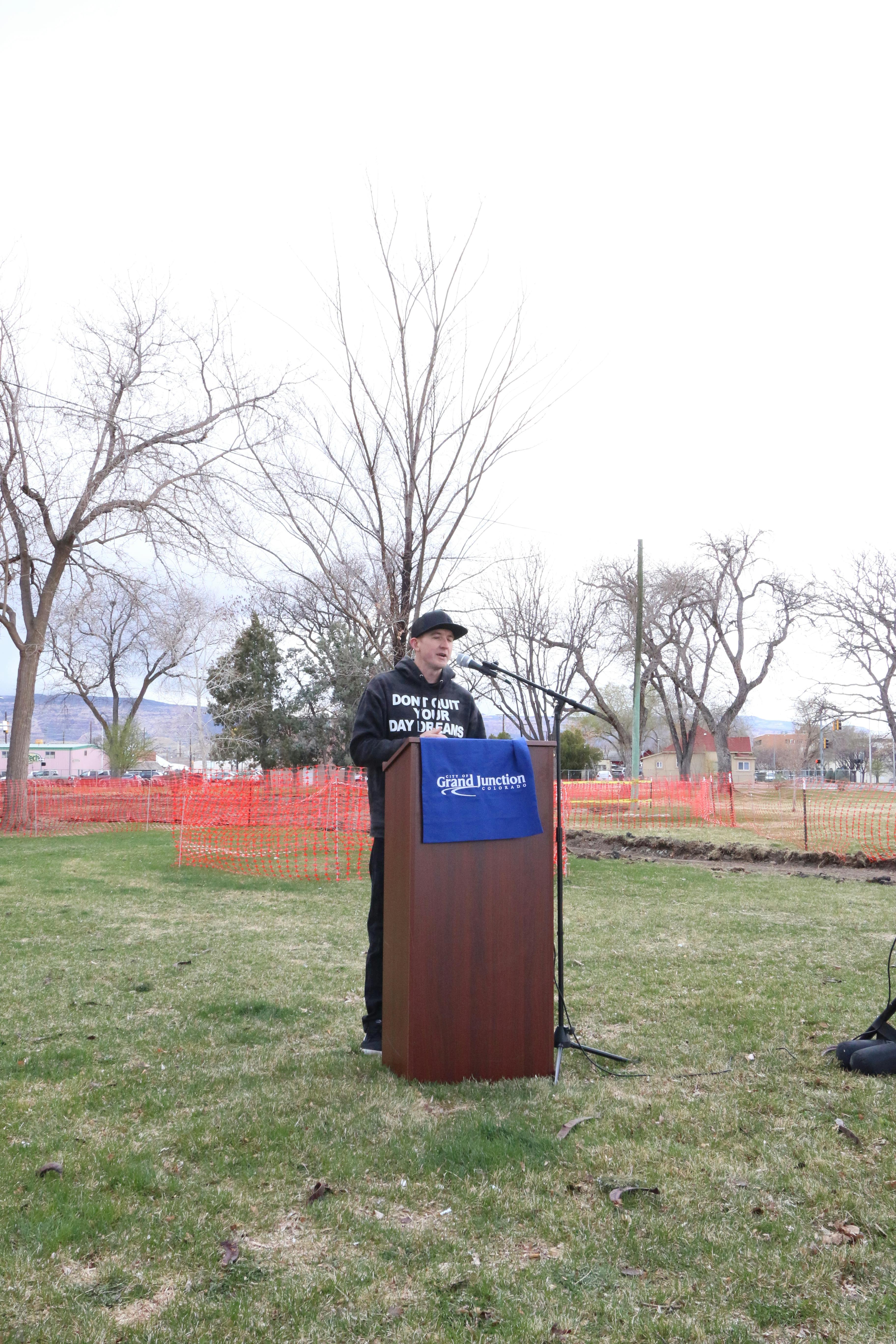 Photo of a person standing at a podium