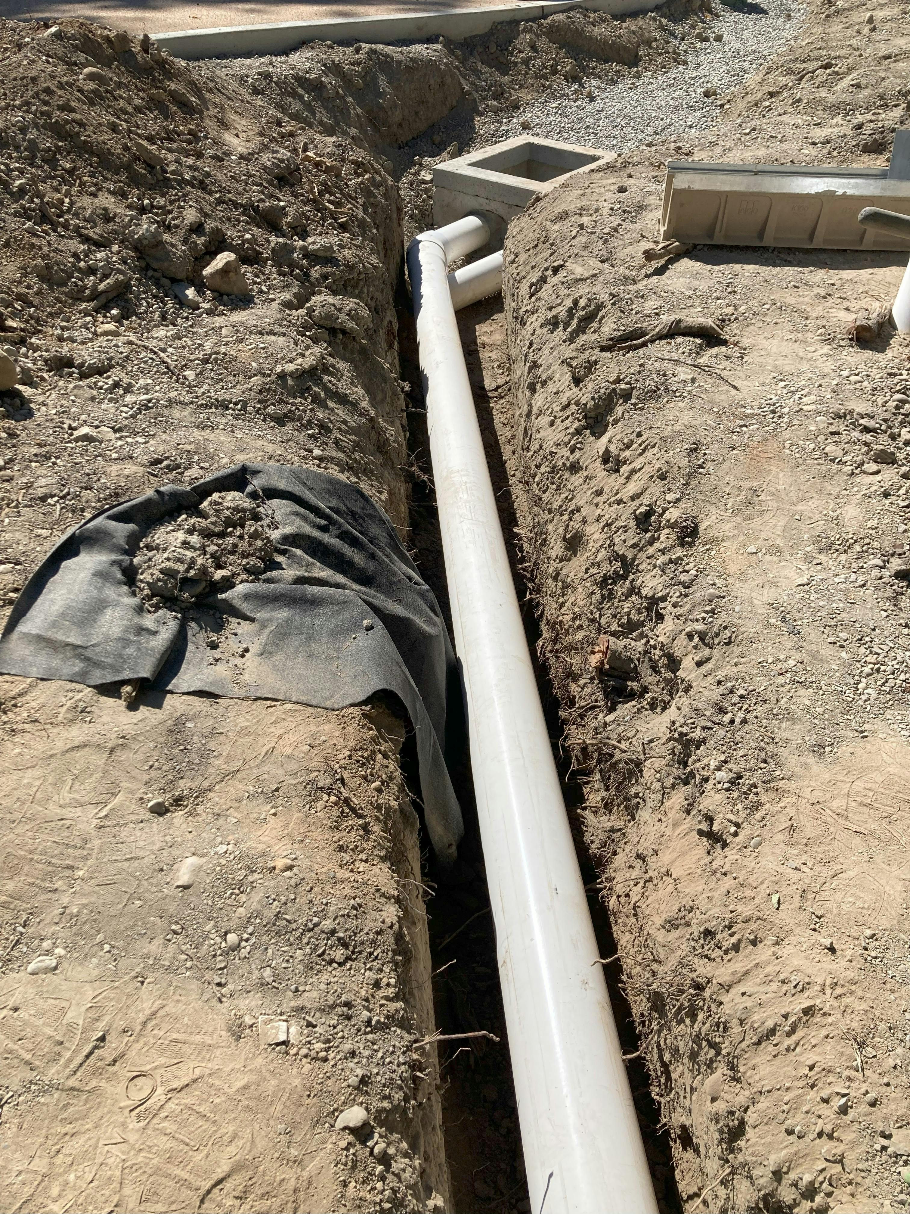 New underdrain in drainage swale