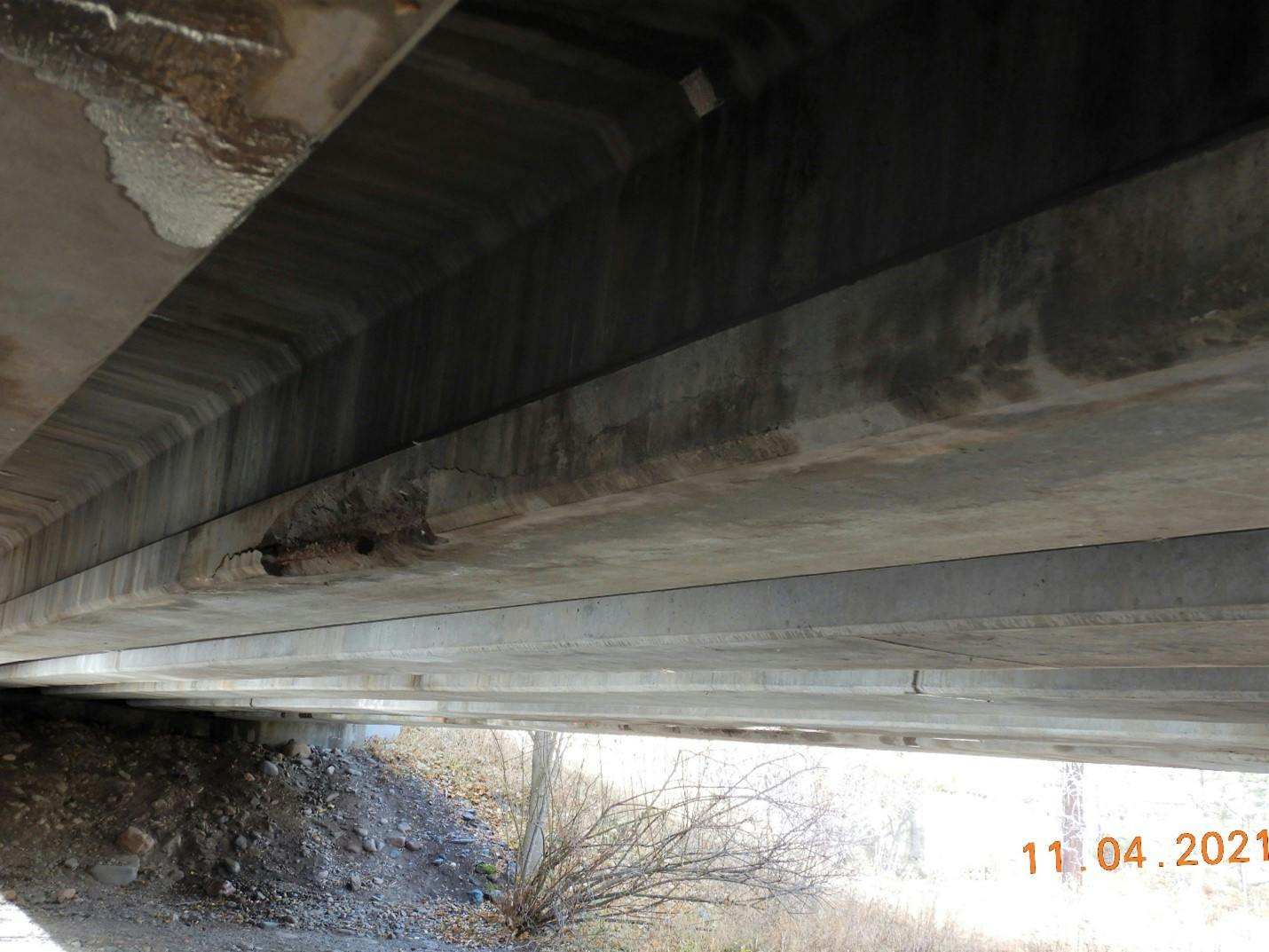 Exposed rebar on one of the prestressed beams