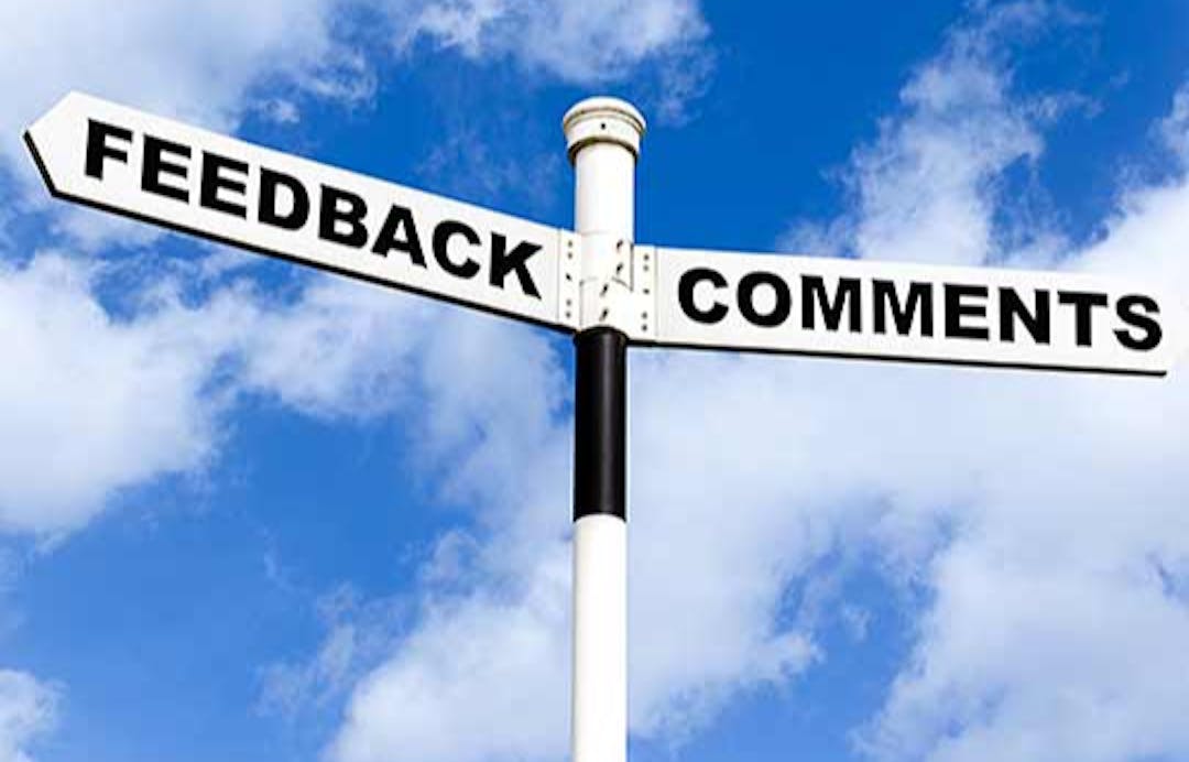 Street sign reading "Feedback" and "Comments"