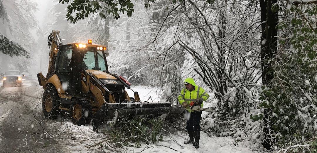 Public Works staff clearing debris during snow event.