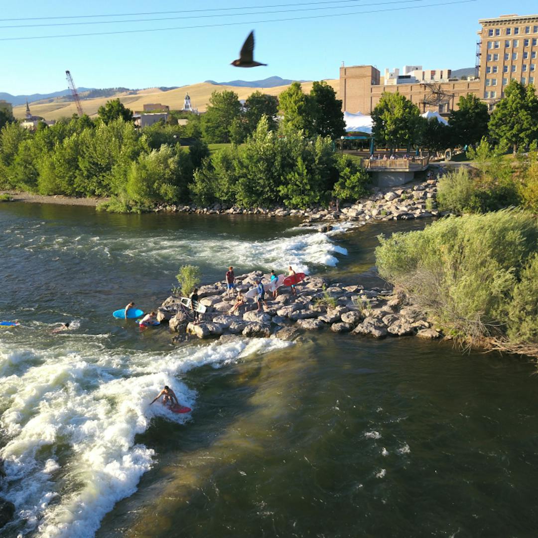 People recreating on the Clark Fork River in downtown Missoula