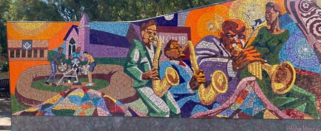 Photo of "Rhapsody" an outdoor mosaic tile mural by John Yancey on East 11th Street in Austin, Texas. 
