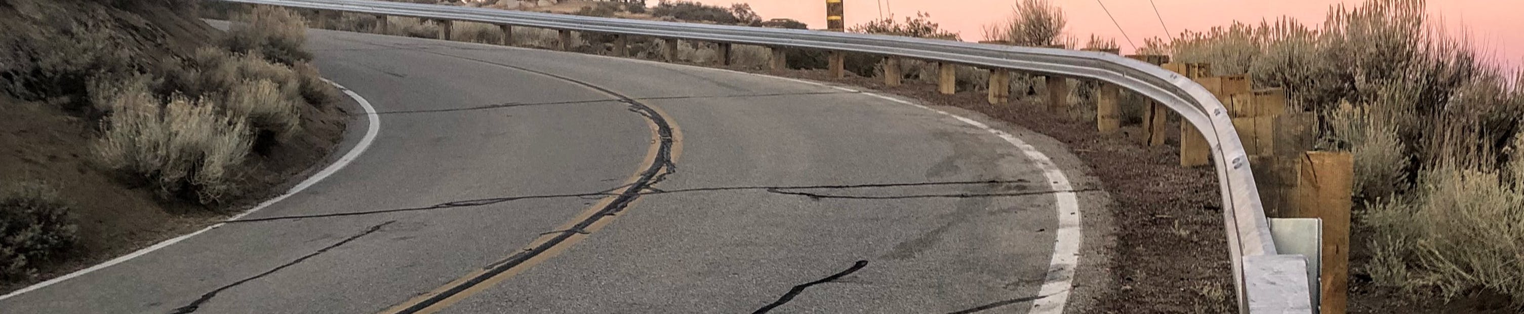 A road guardrail on a curve