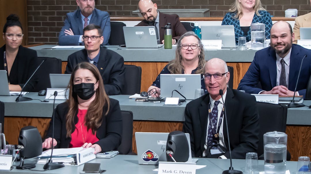 members of the city team including the city manager at a council meeting