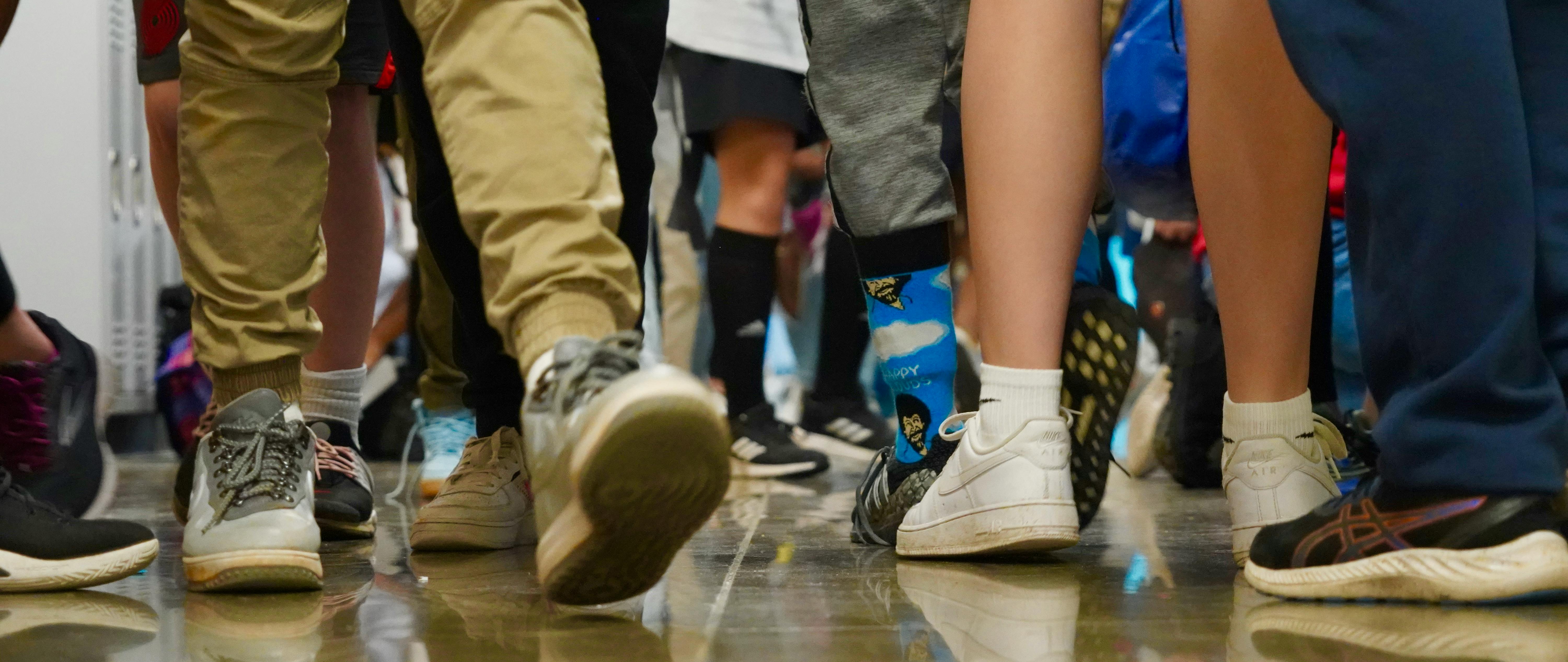 Students' feet in school hallway
