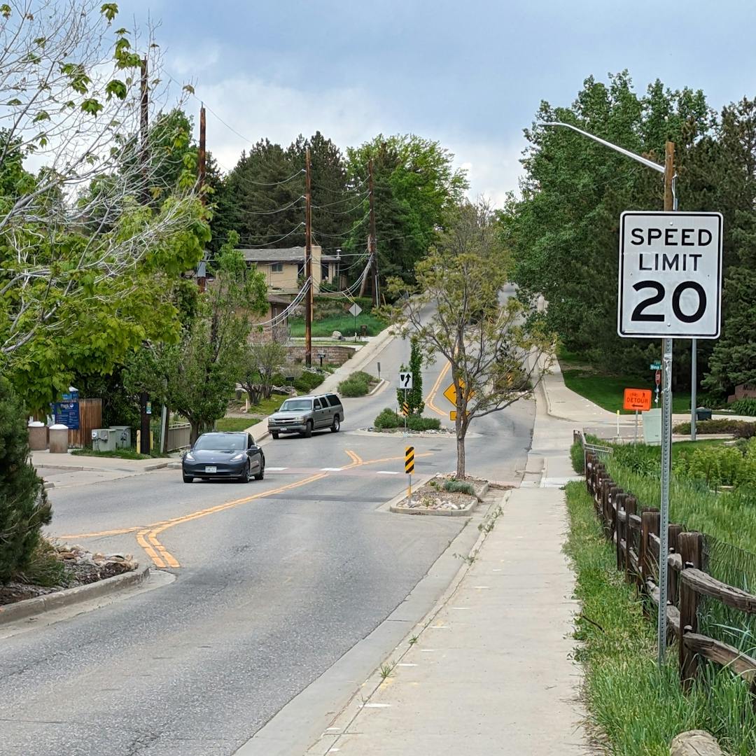 Golden city street with "Speed Limit 20 MPH" signage