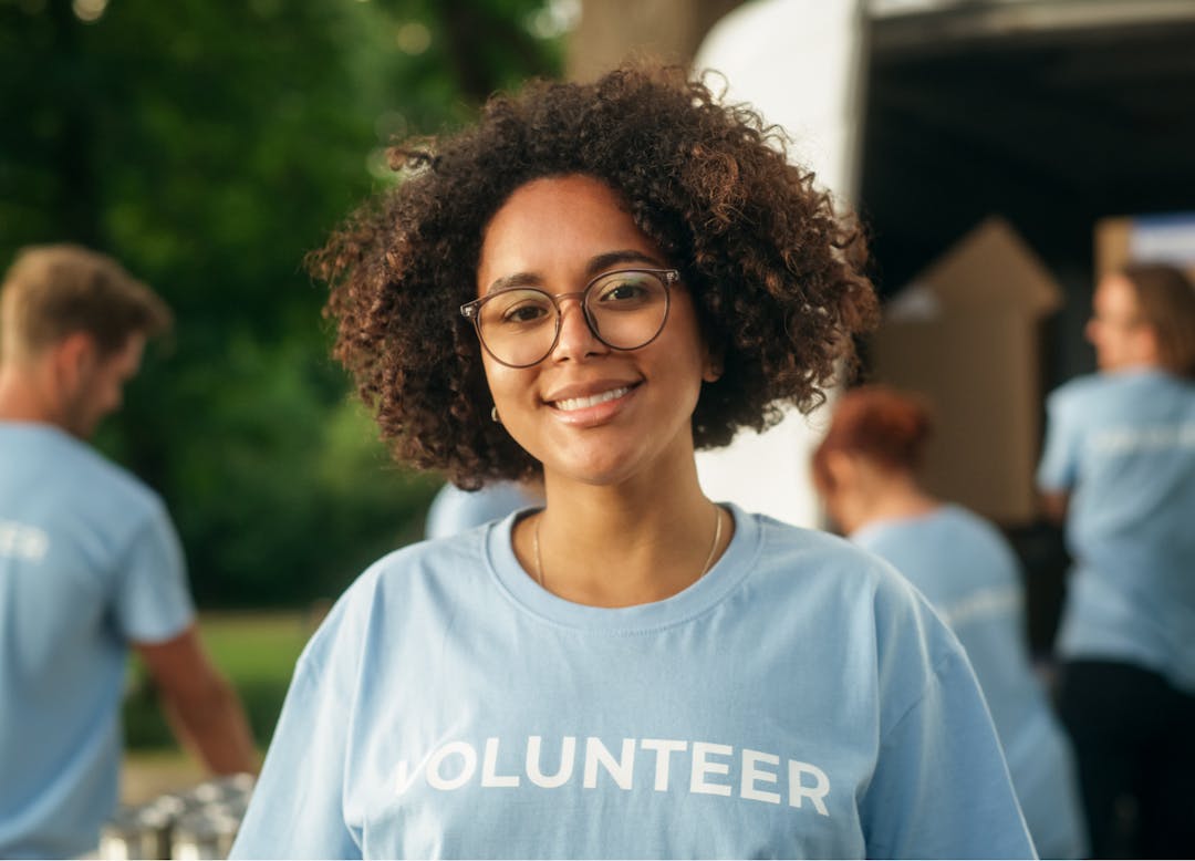 Girl who is volunteering smiling