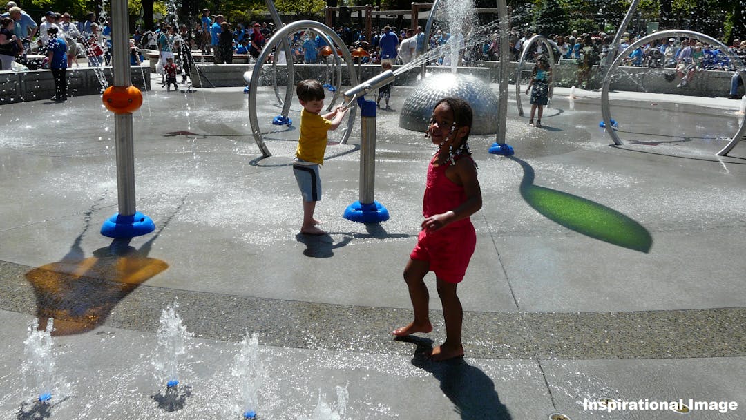 Inspirational Image of kids playing in a splash park.